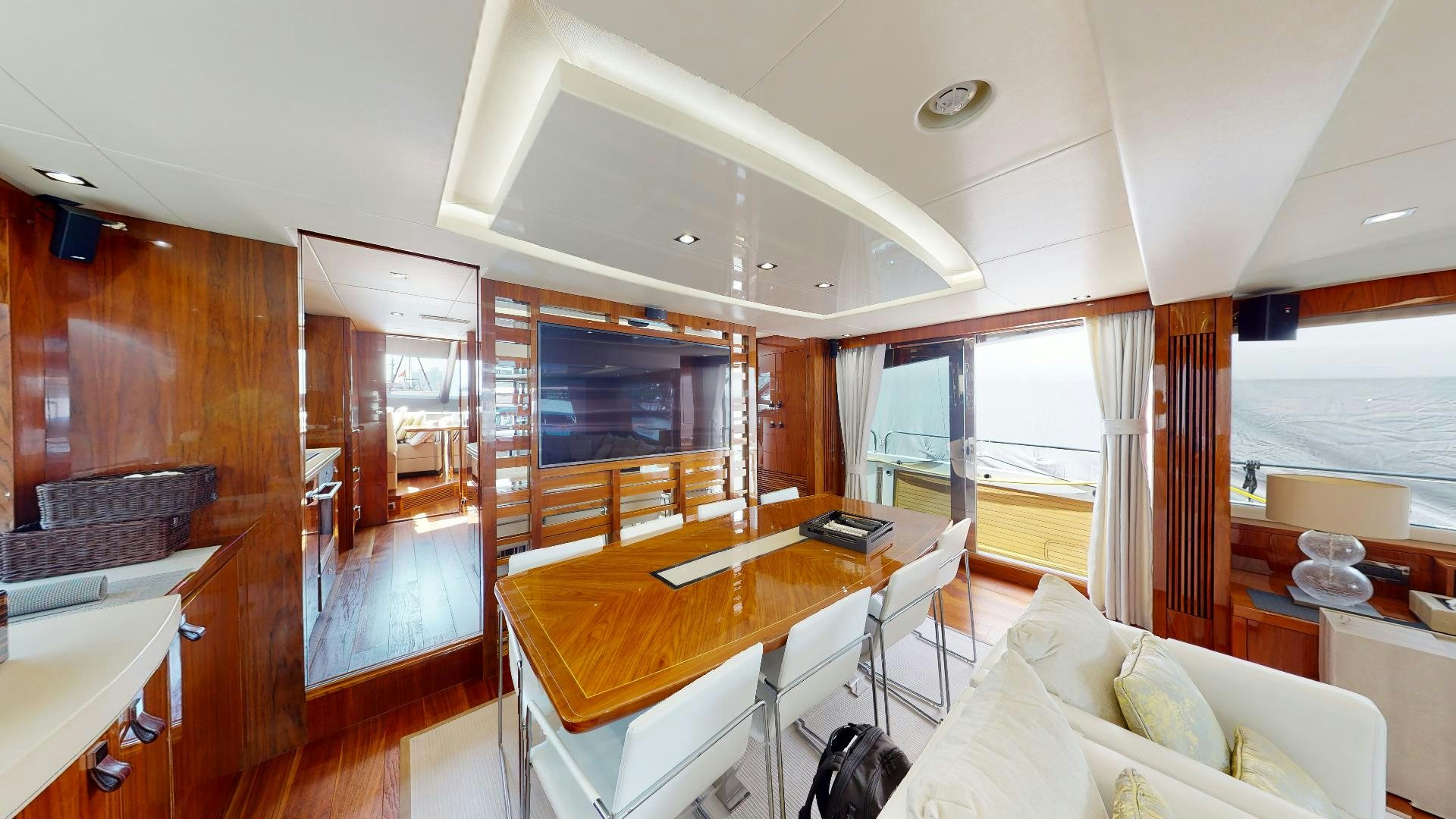 a room with a table and chairs aboard A & K Yacht for Sale