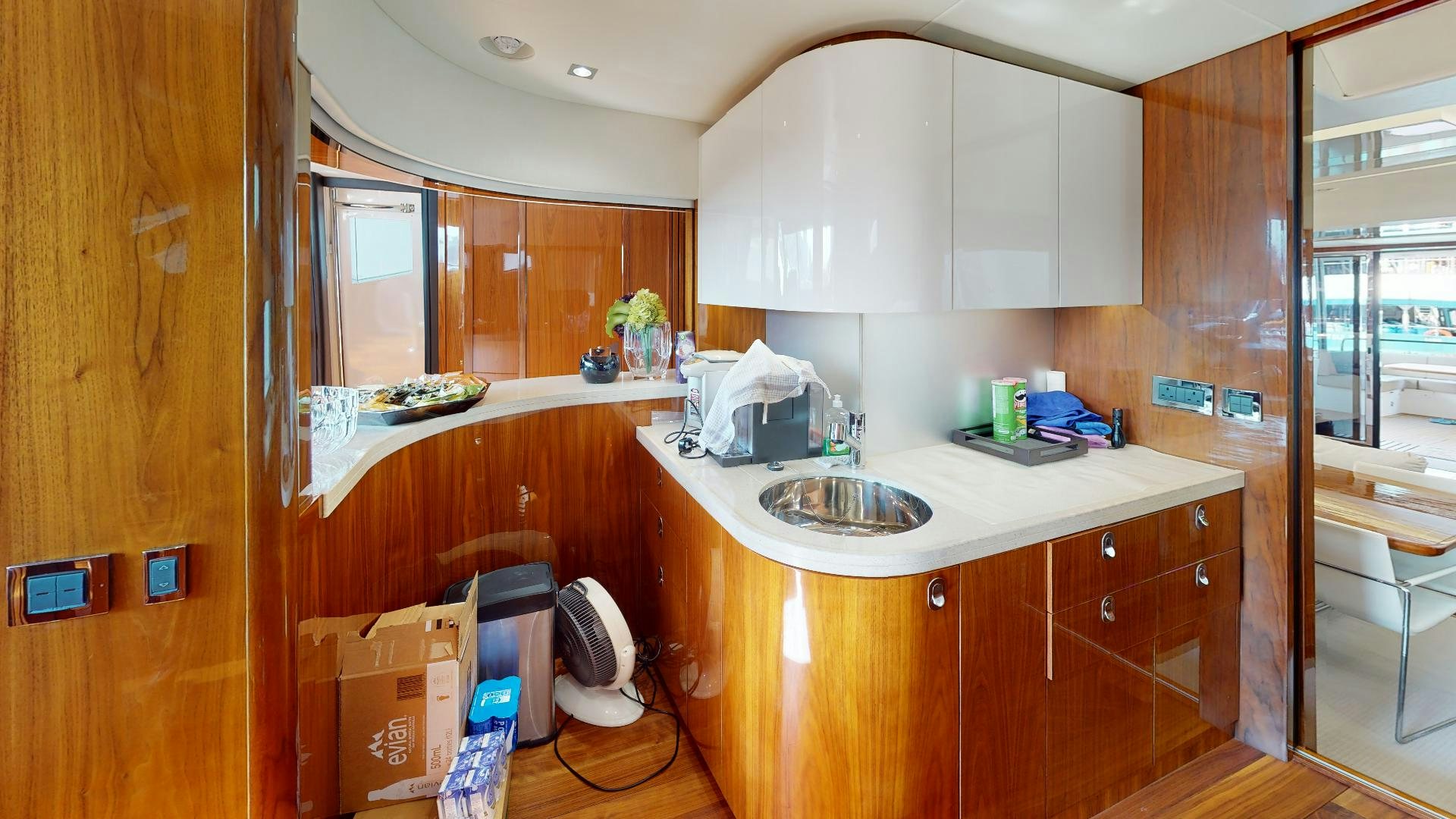 a kitchen with a sink and cabinets aboard A & K Yacht for Sale