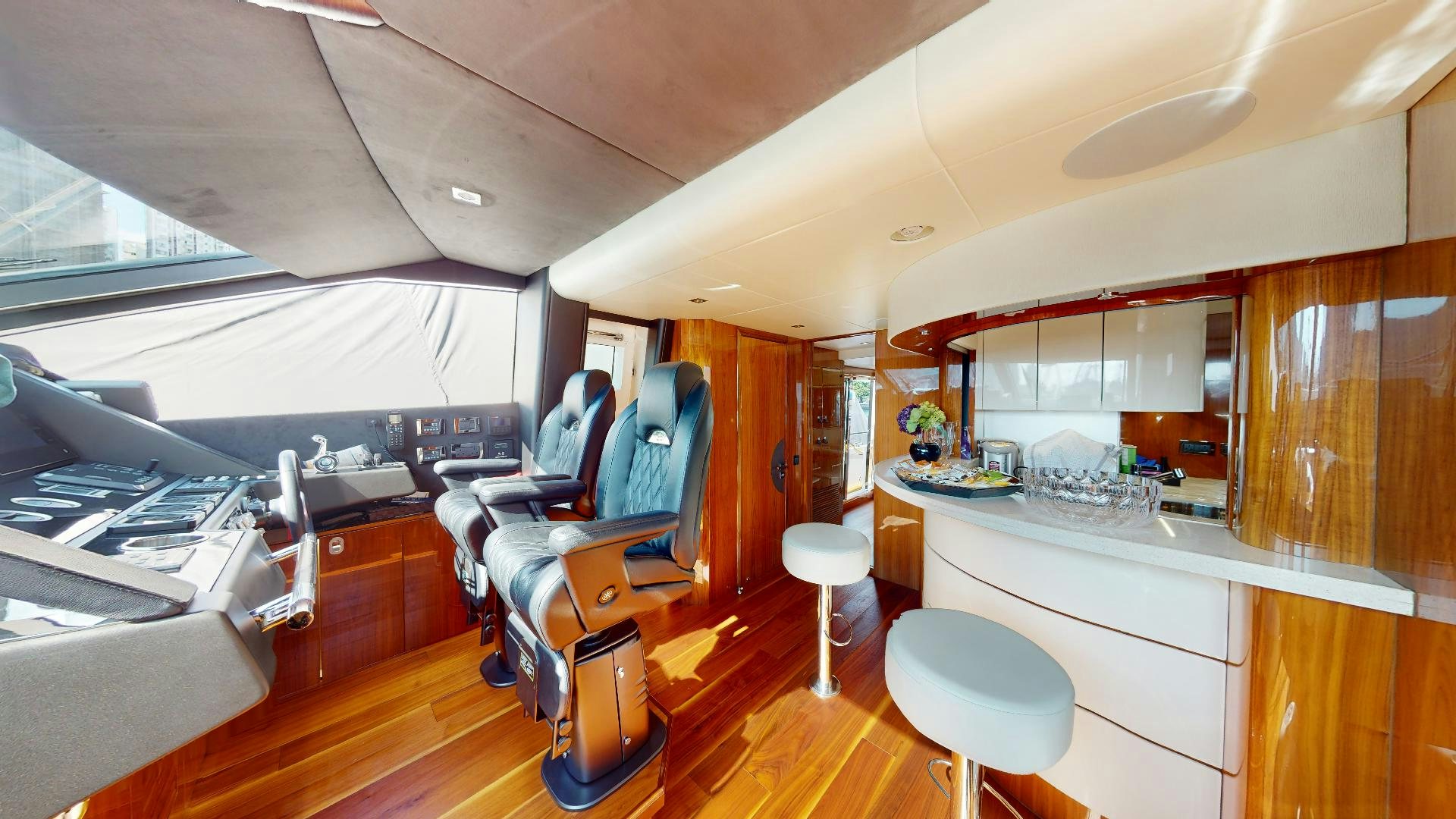 a room with a desk and chairs aboard A & K Yacht for Sale
