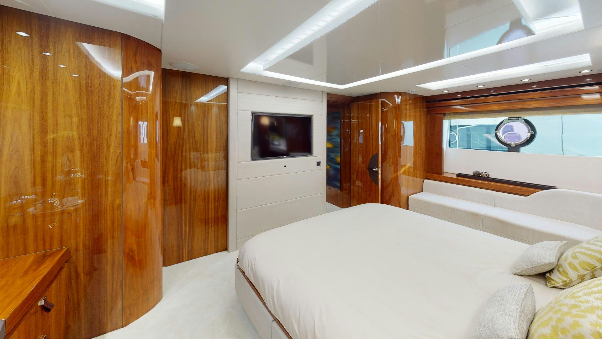 a bedroom with a bed and a television aboard A & K Yacht for Sale