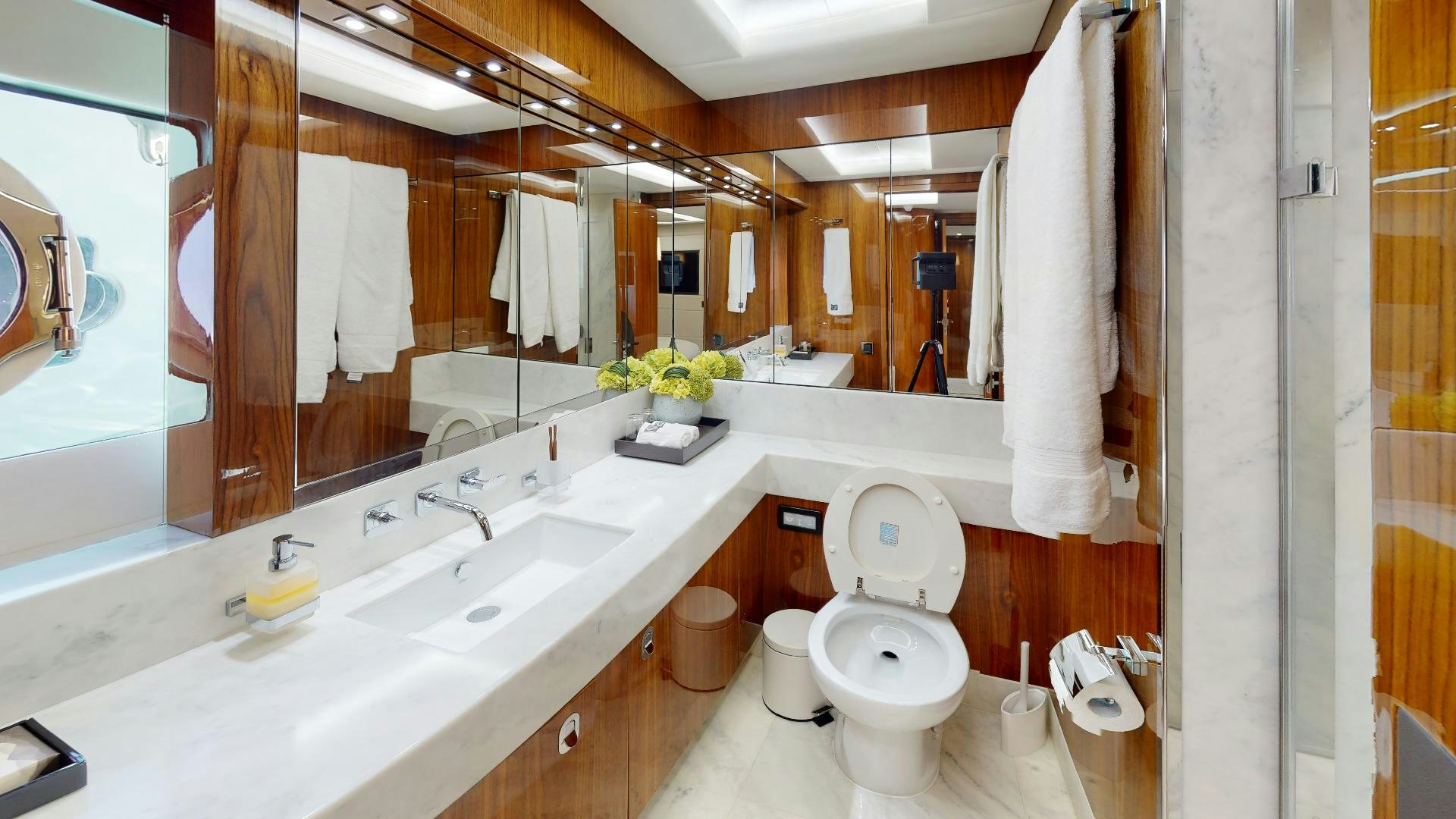 a bathroom with a large mirror aboard A & K Yacht for Sale