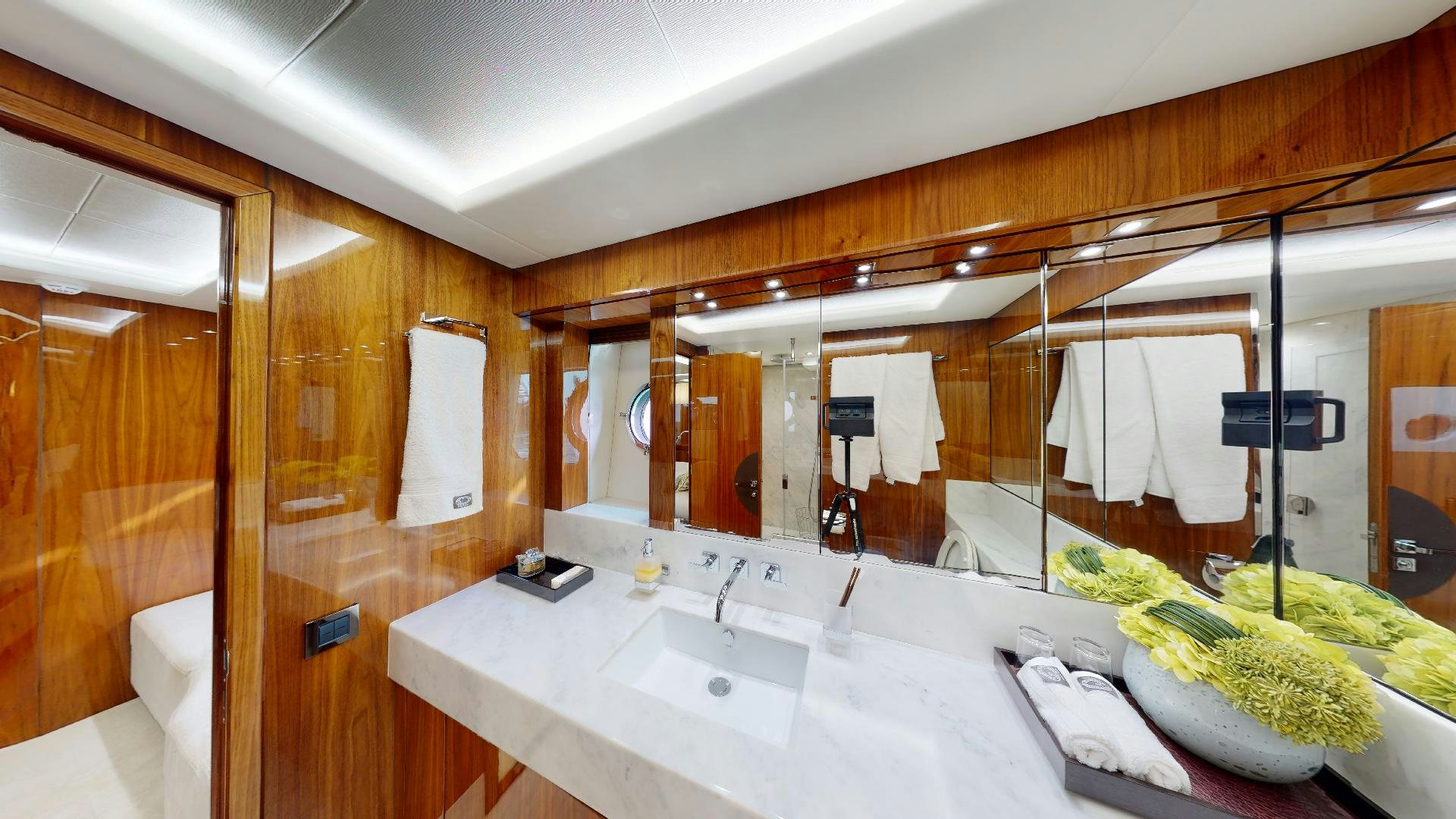 a bathroom with a large mirror aboard A & K Yacht for Sale