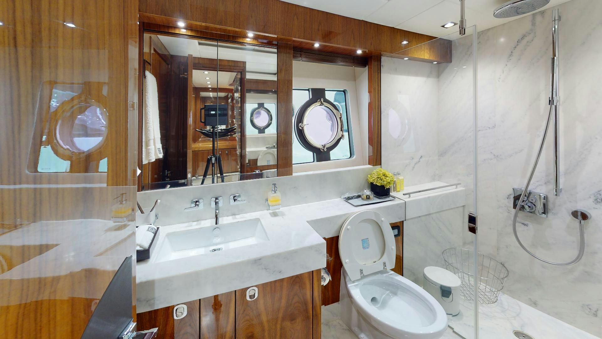 a bathroom with a large mirror aboard A & K Yacht for Sale