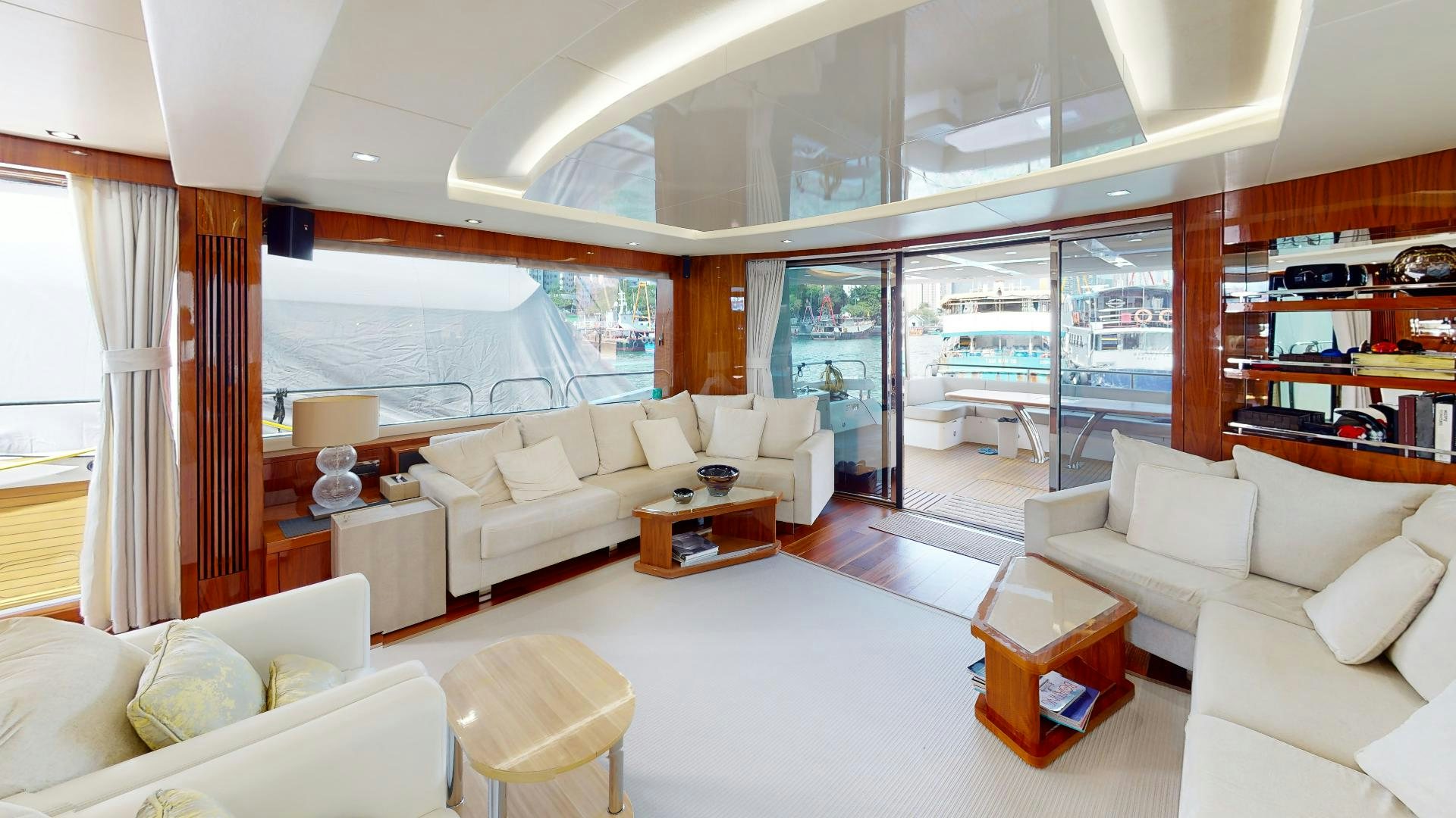 a living room with a large window aboard A & K Yacht for Sale