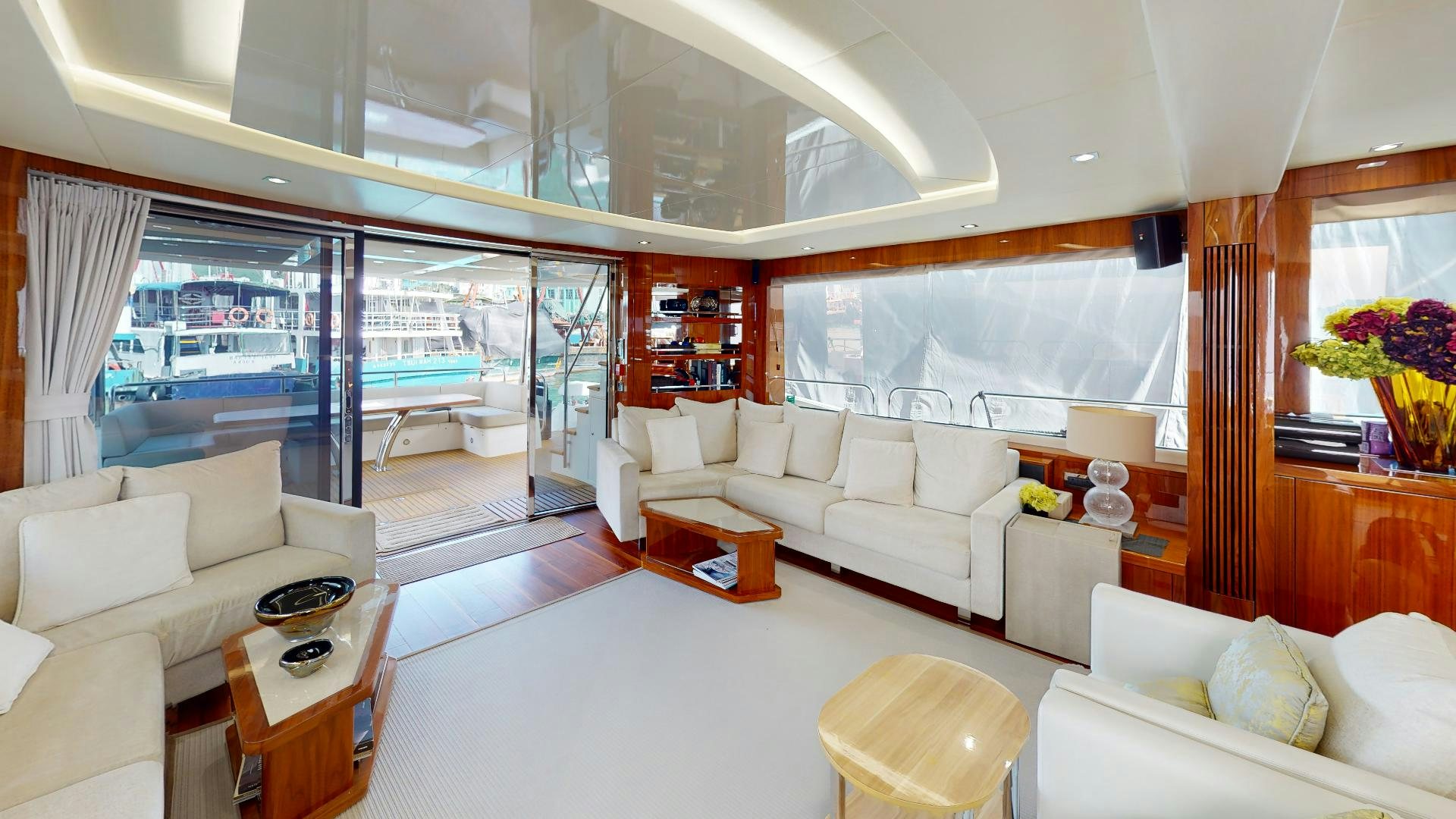 a living room with a large window aboard A & K Yacht for Sale