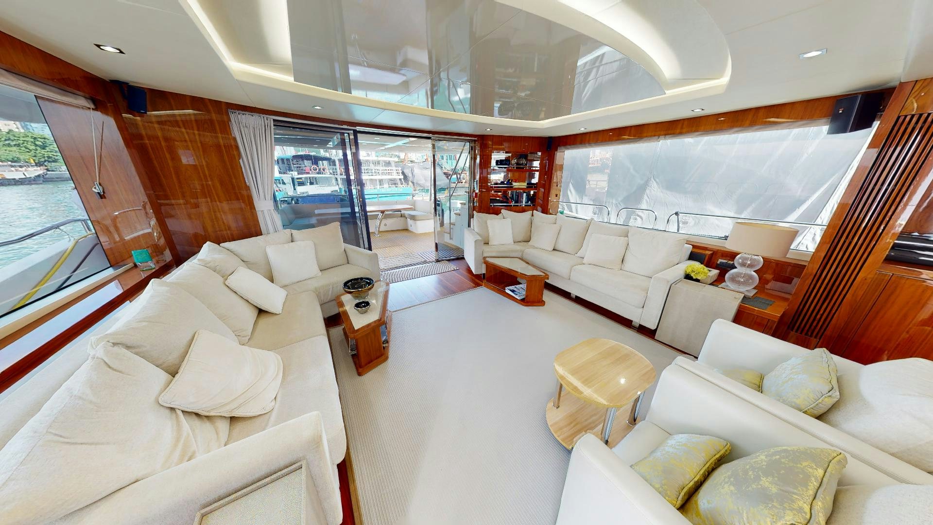 a large living room with a staircase aboard A & K Yacht for Sale