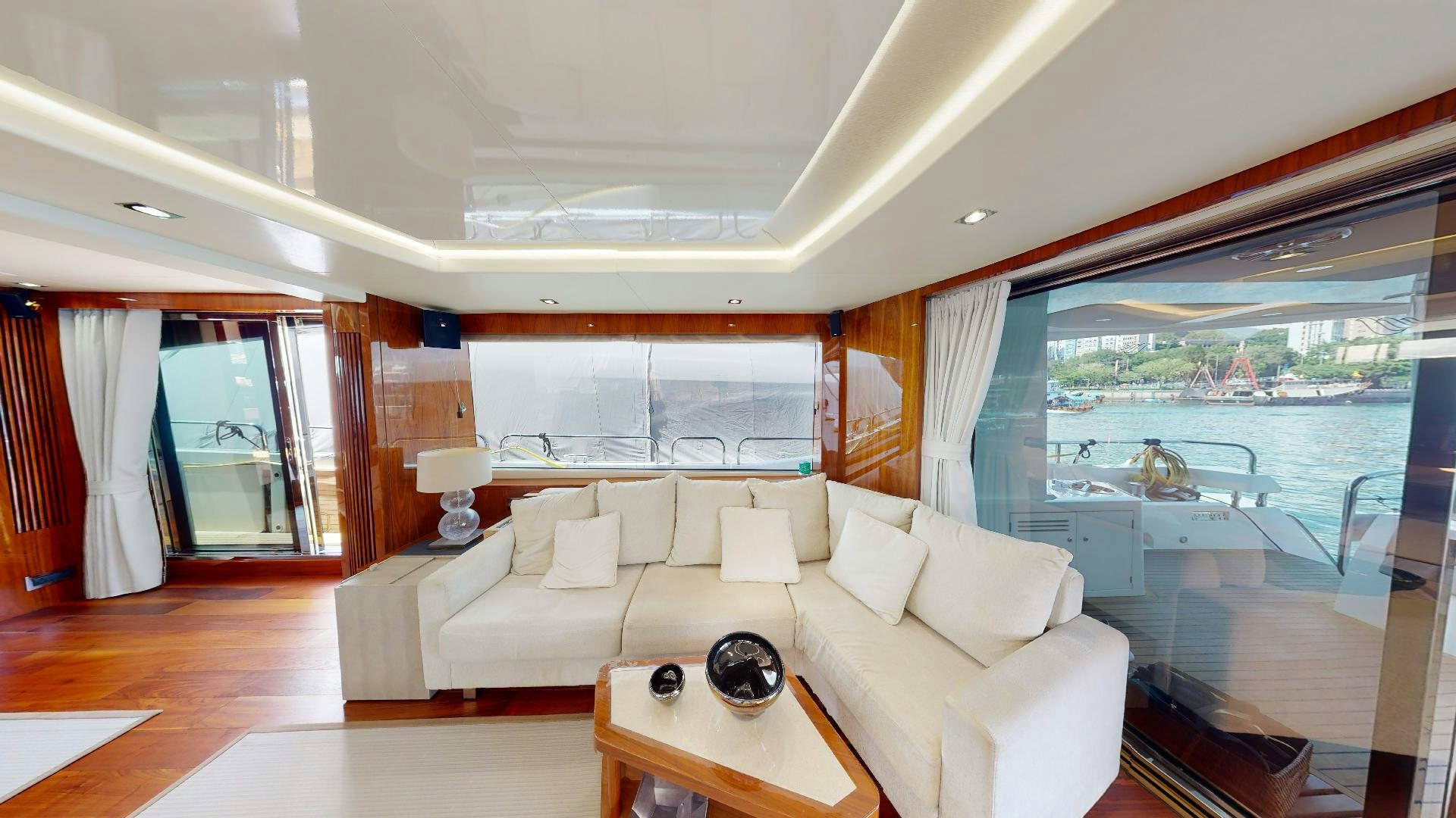 a living room with a large window aboard A & K Yacht for Sale