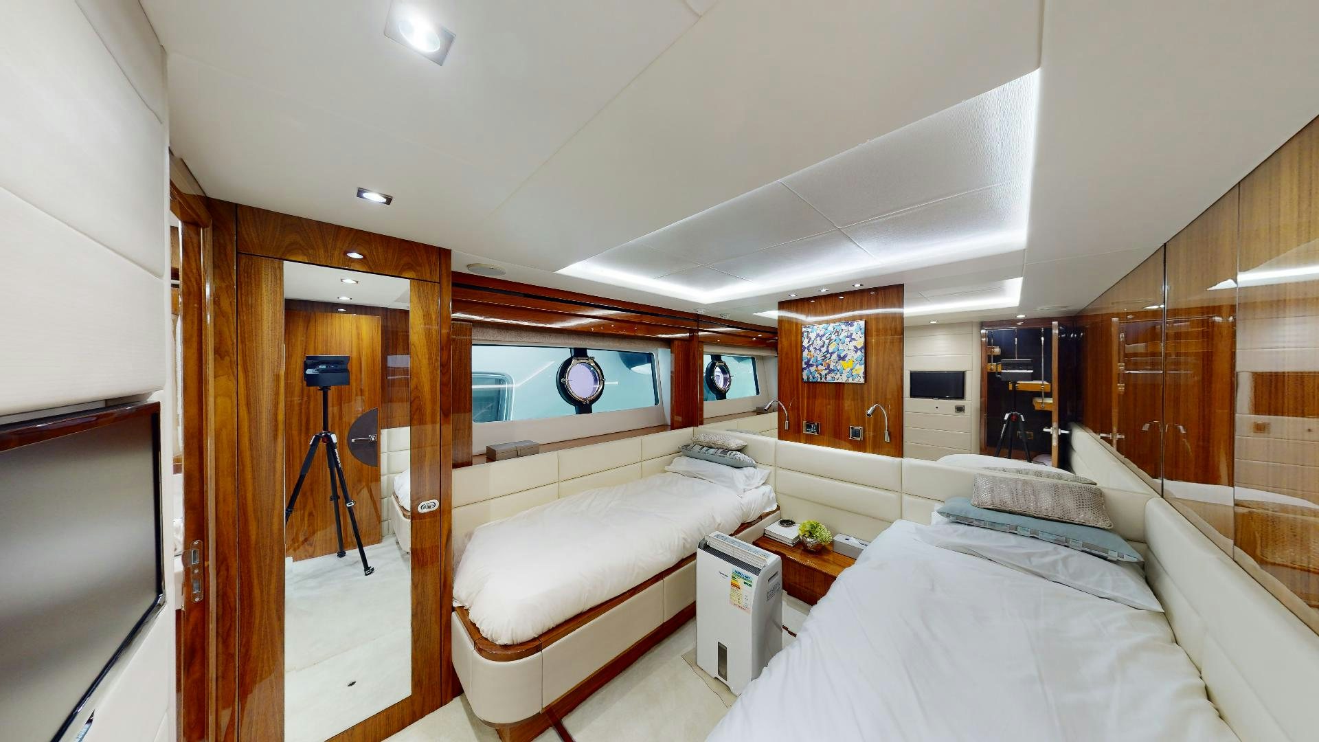 a room with a bed and a television aboard A & K Yacht for Sale