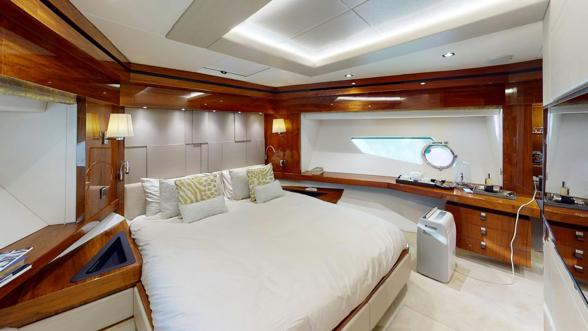 a room with a bed and a desk aboard A & K Yacht for Sale