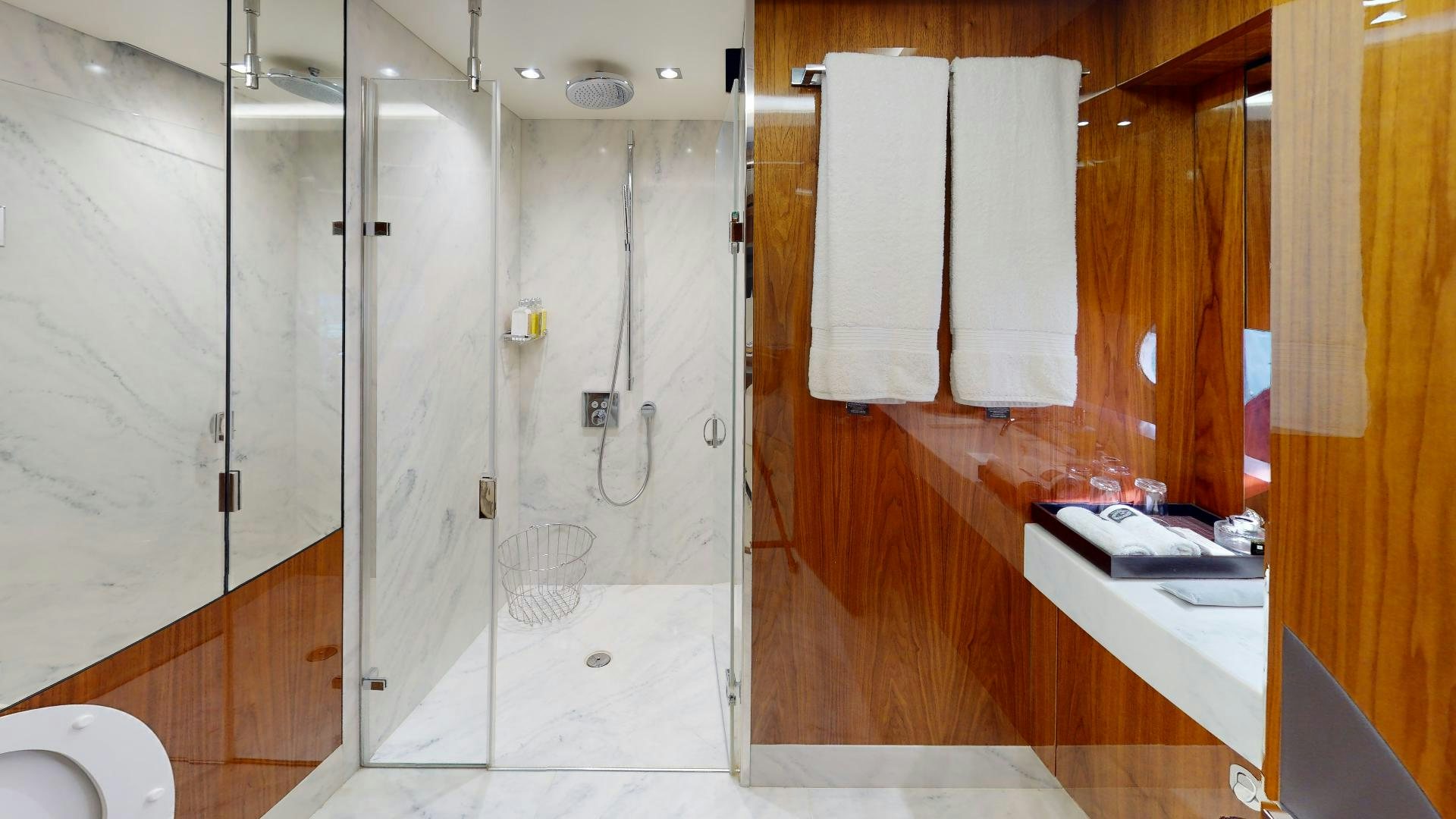 a bathroom with a shower unit aboard A & K Yacht for Sale
