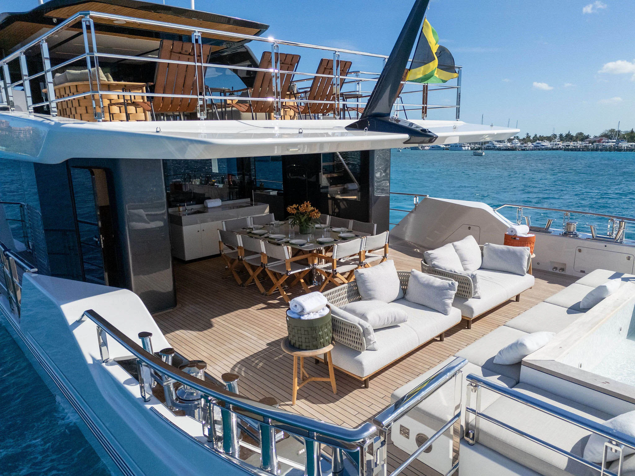 a deck with a large boat and chairs on it aboard ANDREIKA V Yacht for Charter