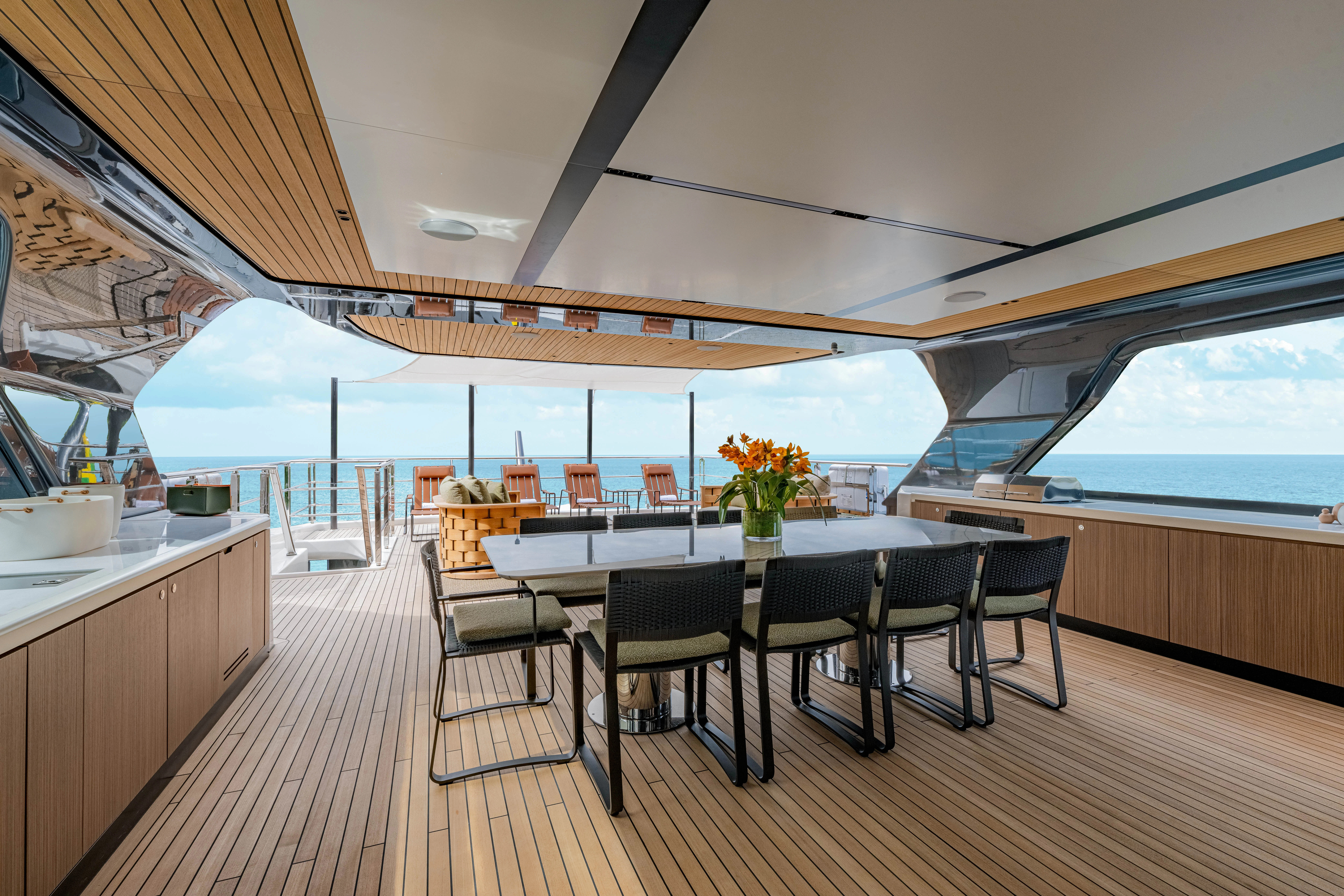 a large room with a table and chairs aboard ANDREIKA V Yacht for Charter