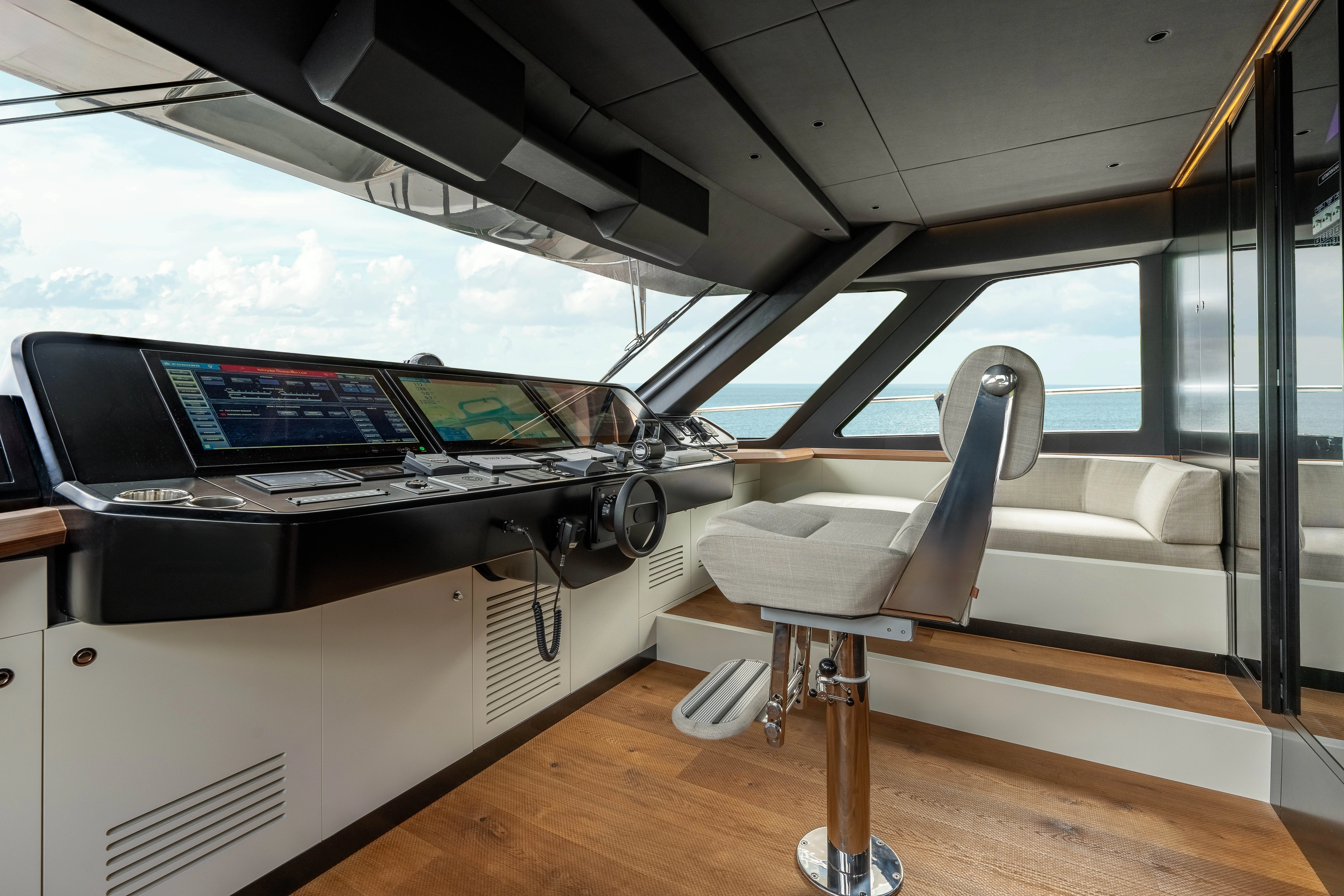 a room with a large desk and a large window with a computer on it aboard ANDREIKA V Yacht for Charter