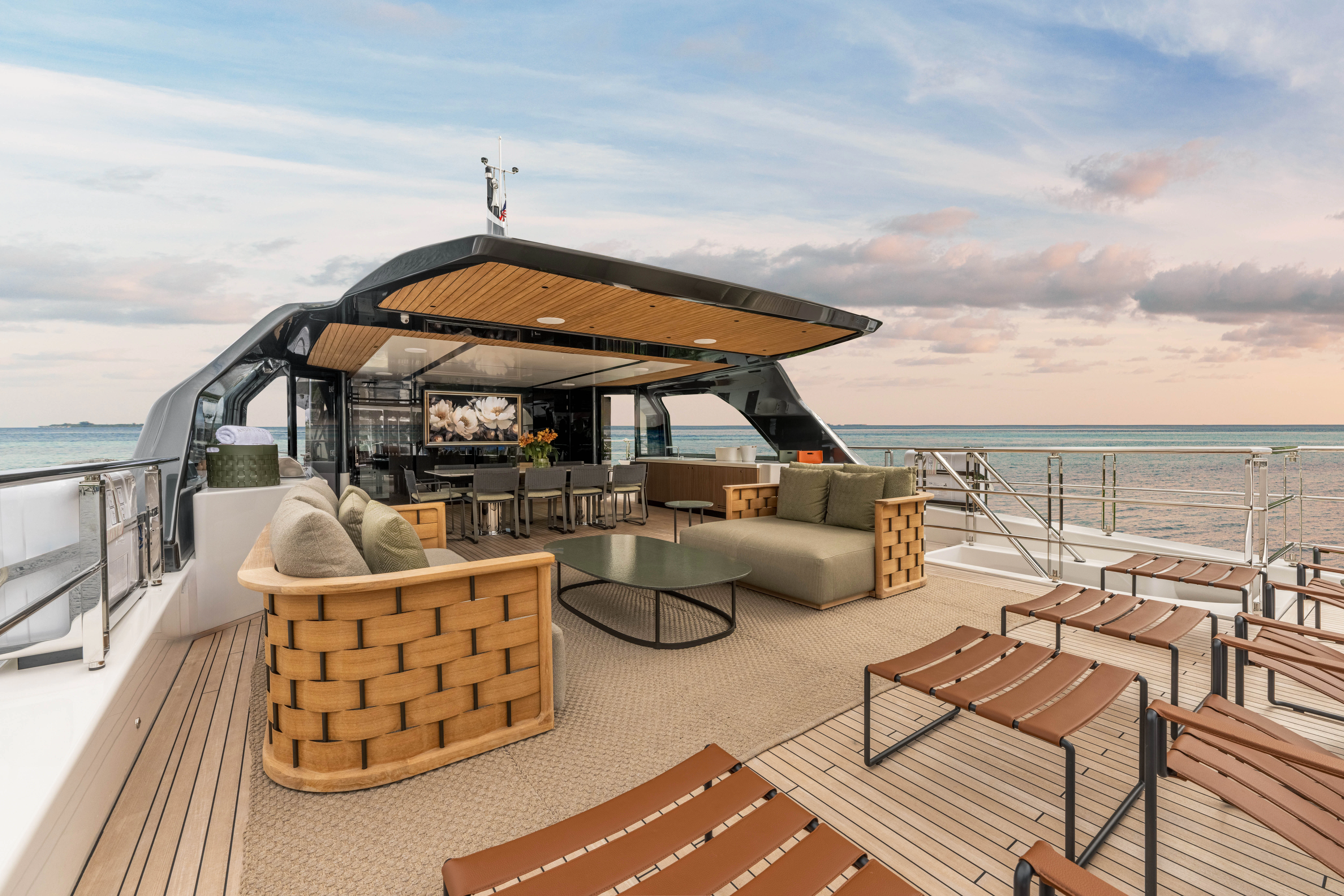 a deck with a couch and a large umbrella on it aboard ANDREIKA V Yacht for Charter