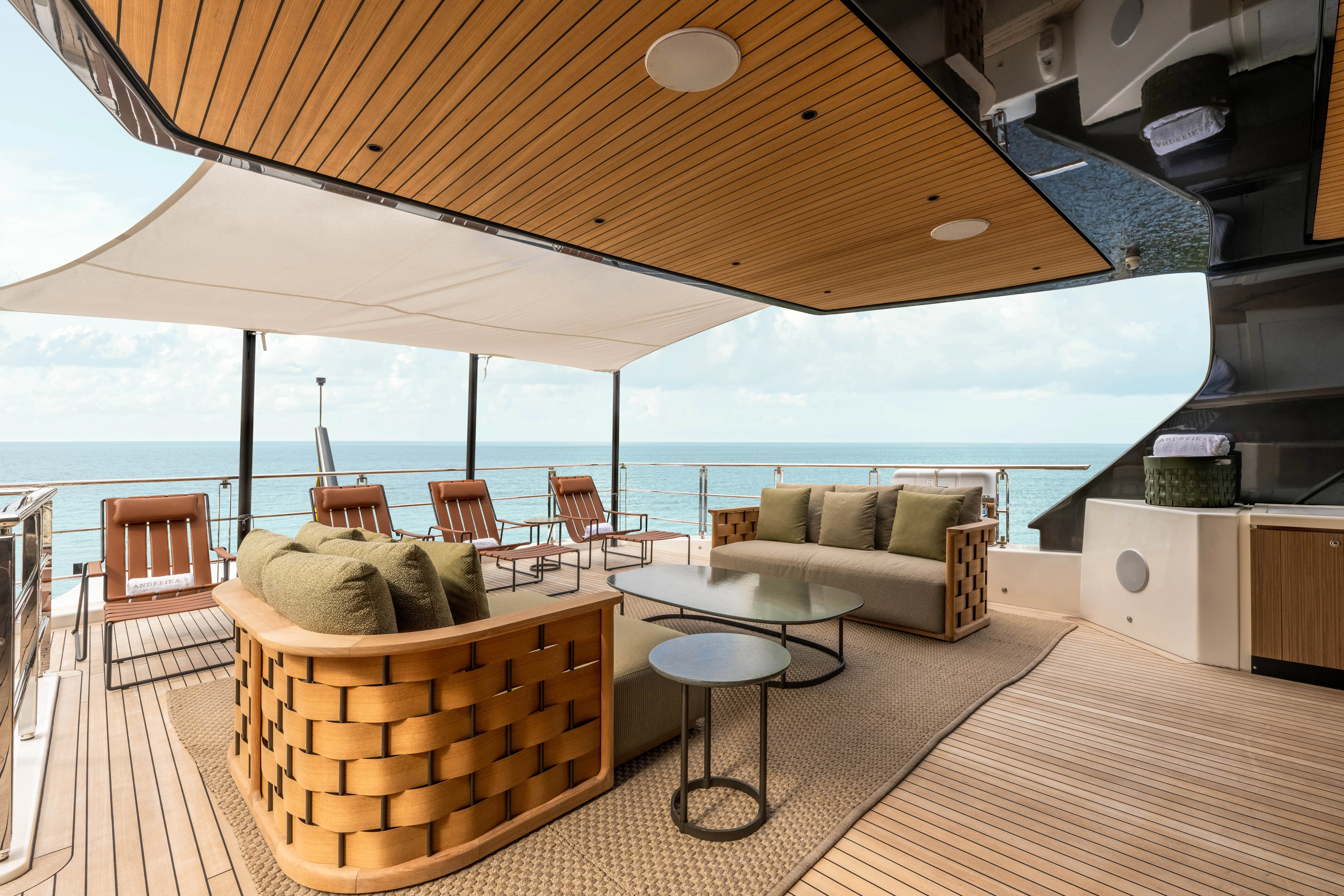 a living room with a large balcony aboard ANDREIKA V Yacht for Charter