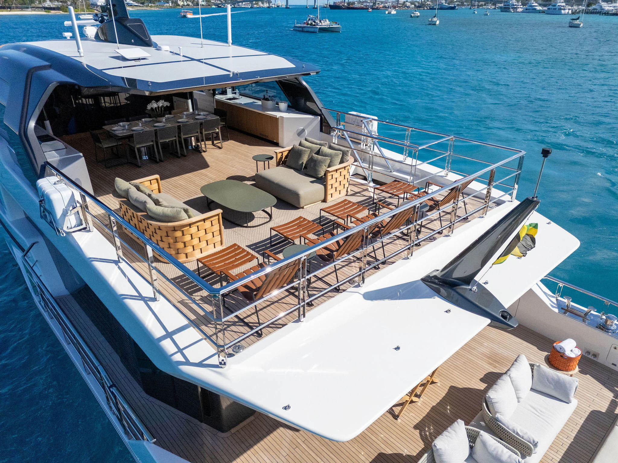a deck with a boat and chairs on it aboard ANDREIKA V Yacht for Charter