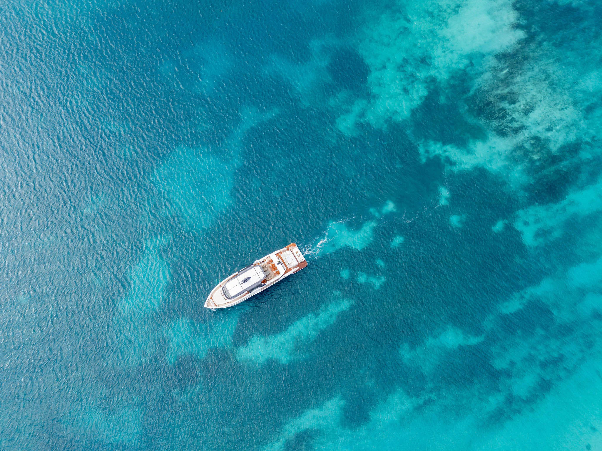 a white car in the water aboard ANDREIKA V Yacht for Charter