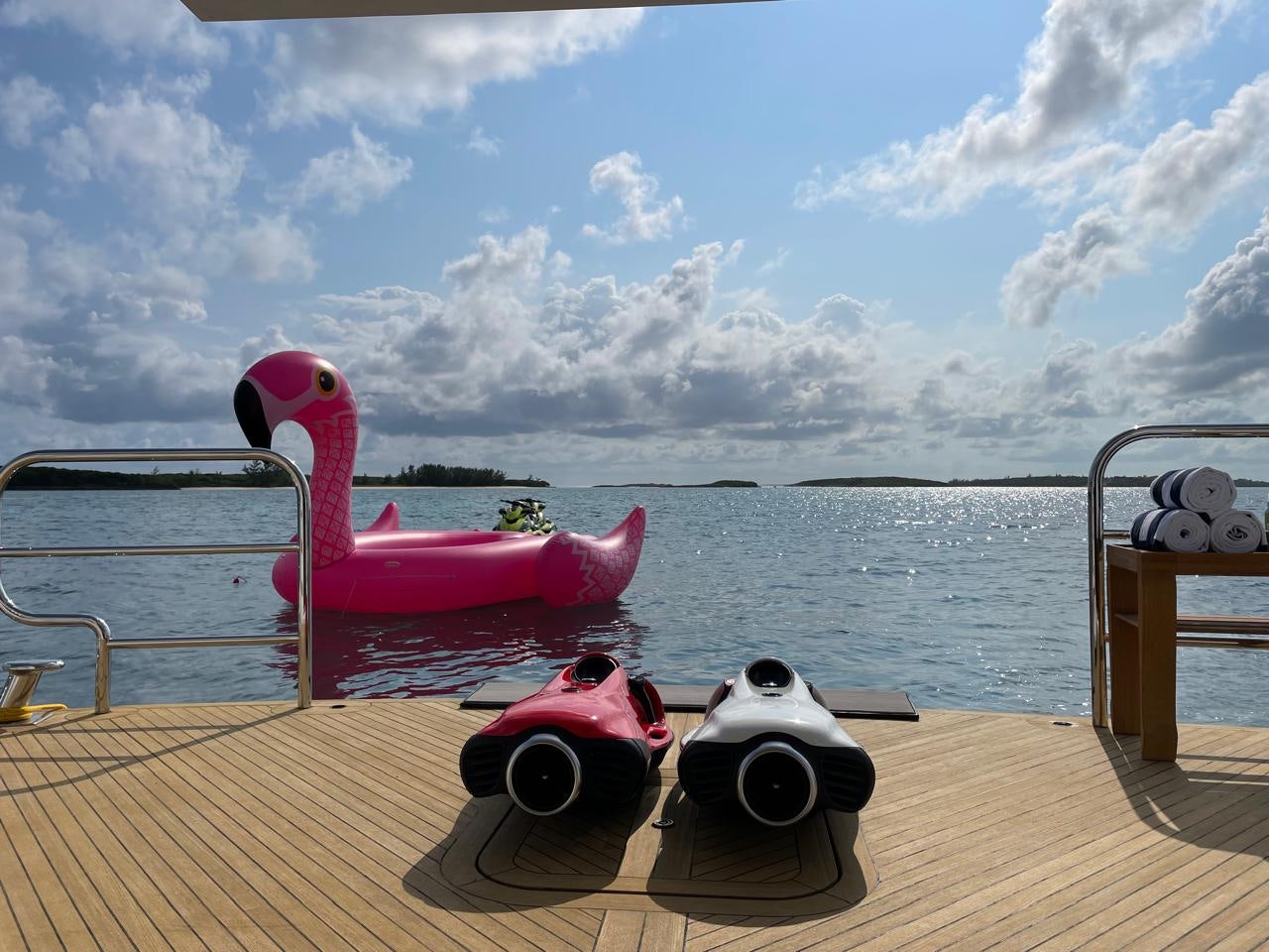 a pink and white boat on a dock with a pink and white dog toy on it aboard IMPROMPTU Yacht for Charter