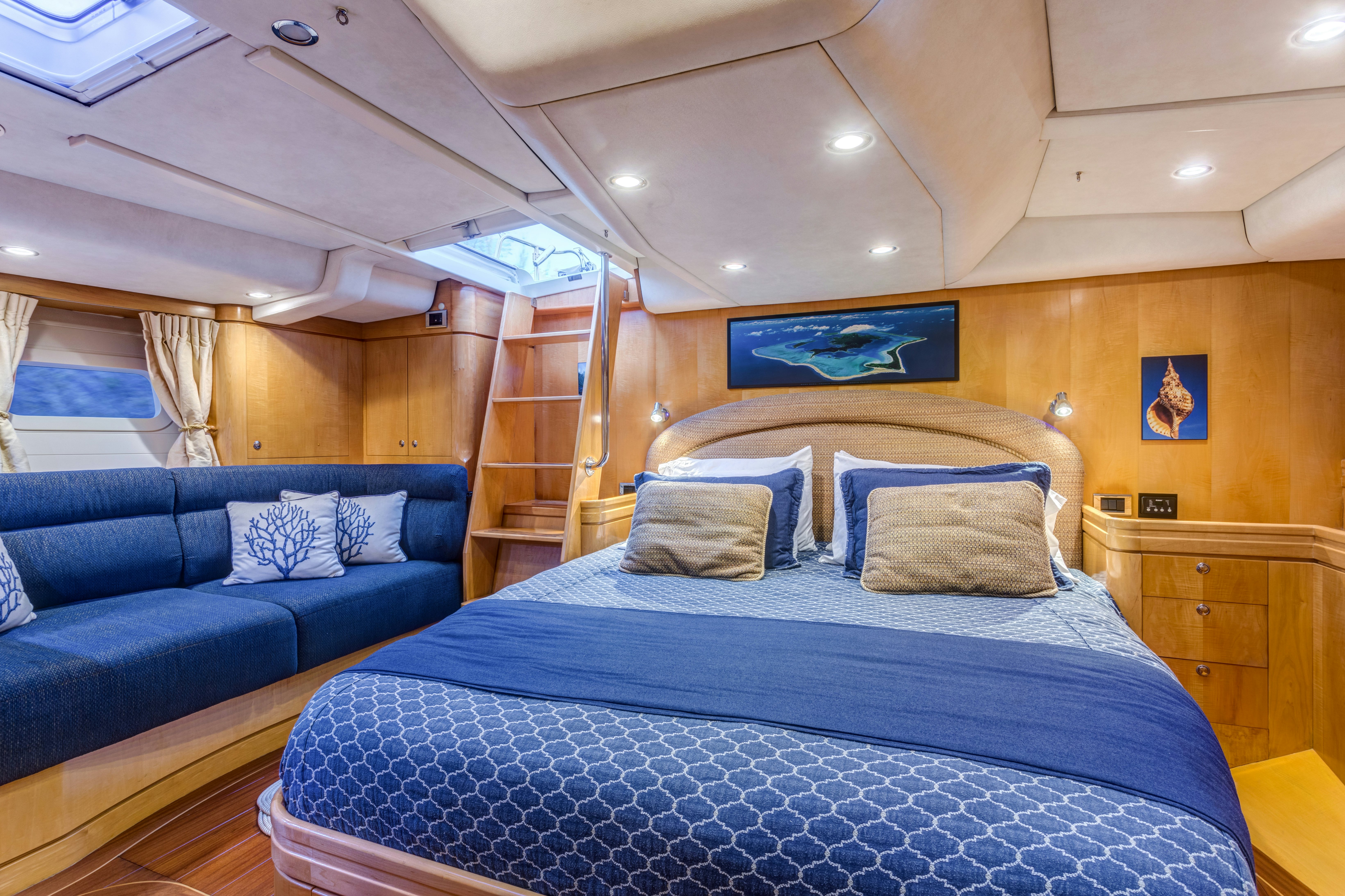 a bed in a room aboard LADY K Yacht for Sale
