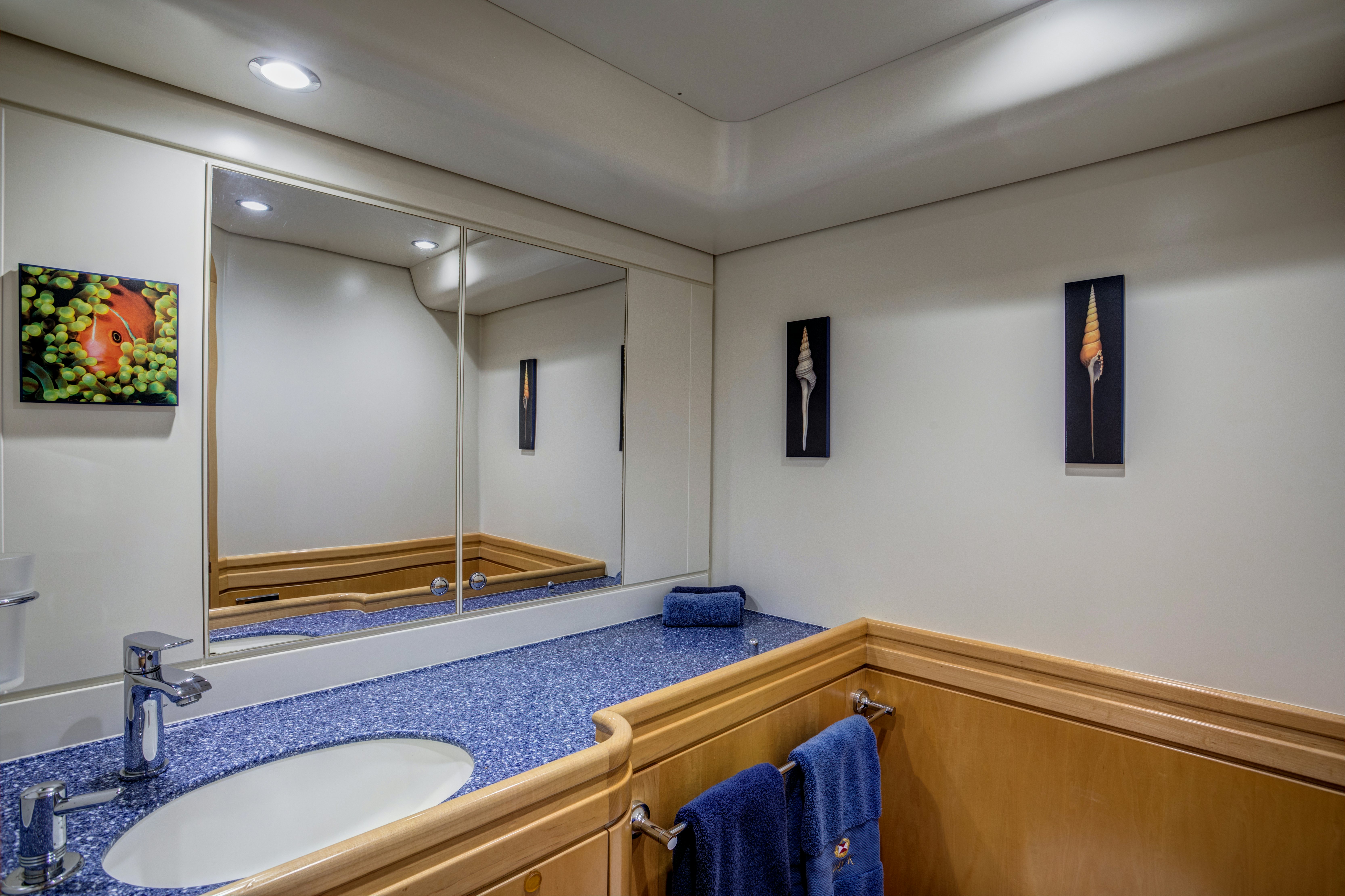 a bathroom with a large mirror aboard LADY K Yacht for Sale