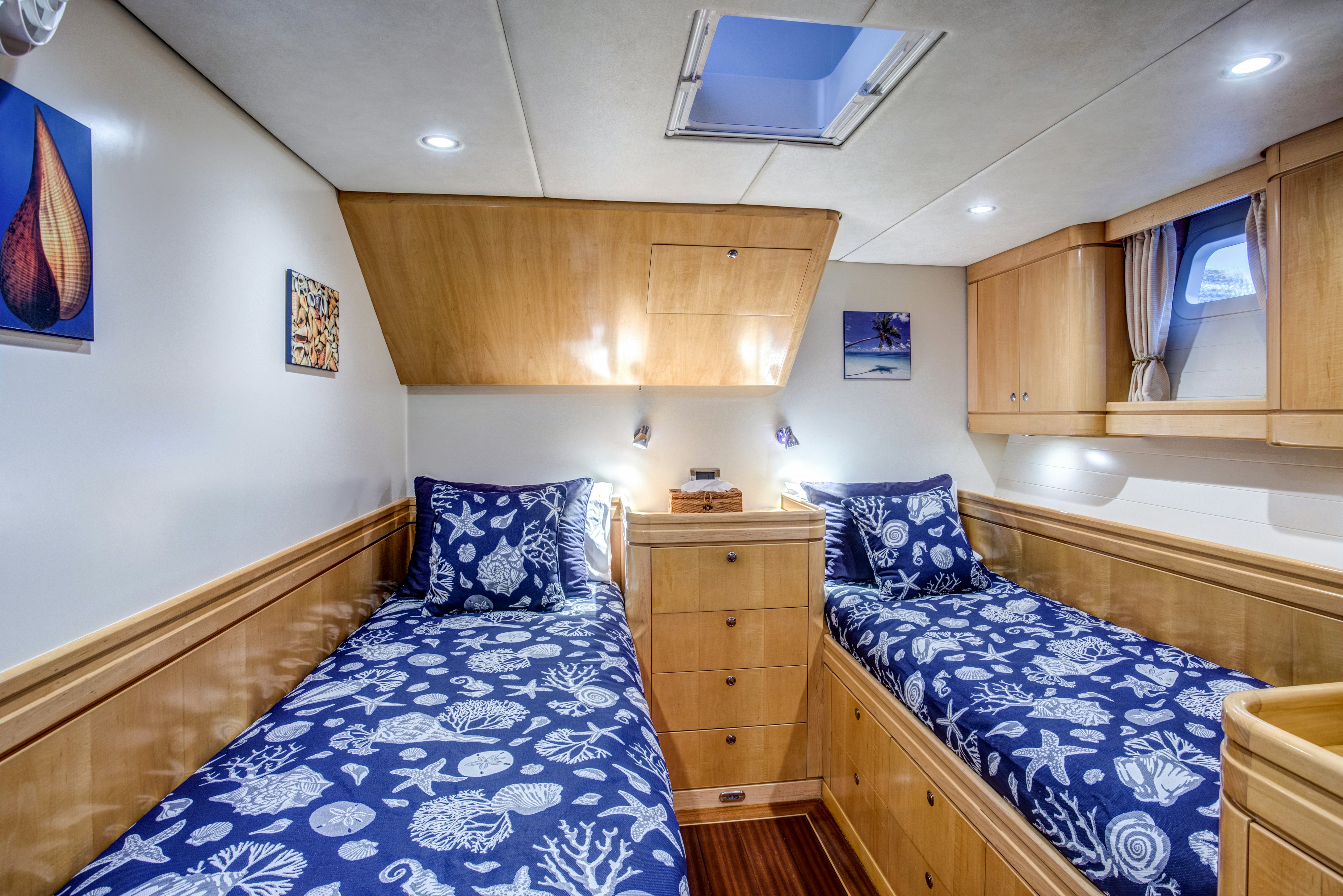 a bedroom with wood cabinets aboard LADY K Yacht for Sale