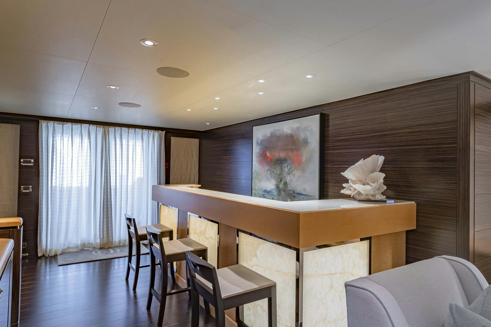 a room with a table and chairs aboard REVELRY Yacht for Charter