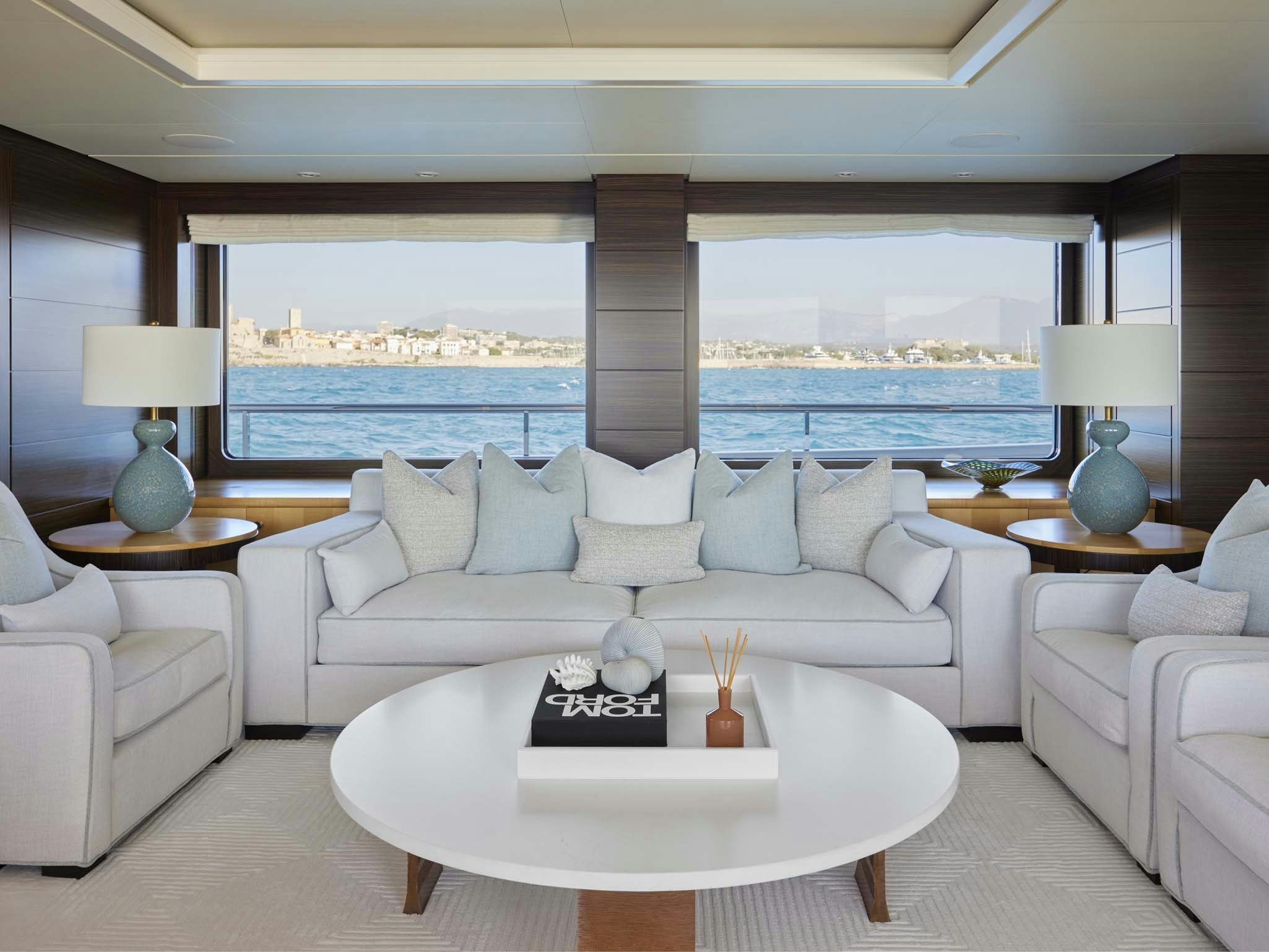 a living room with a large window aboard REVELRY Yacht for Charter