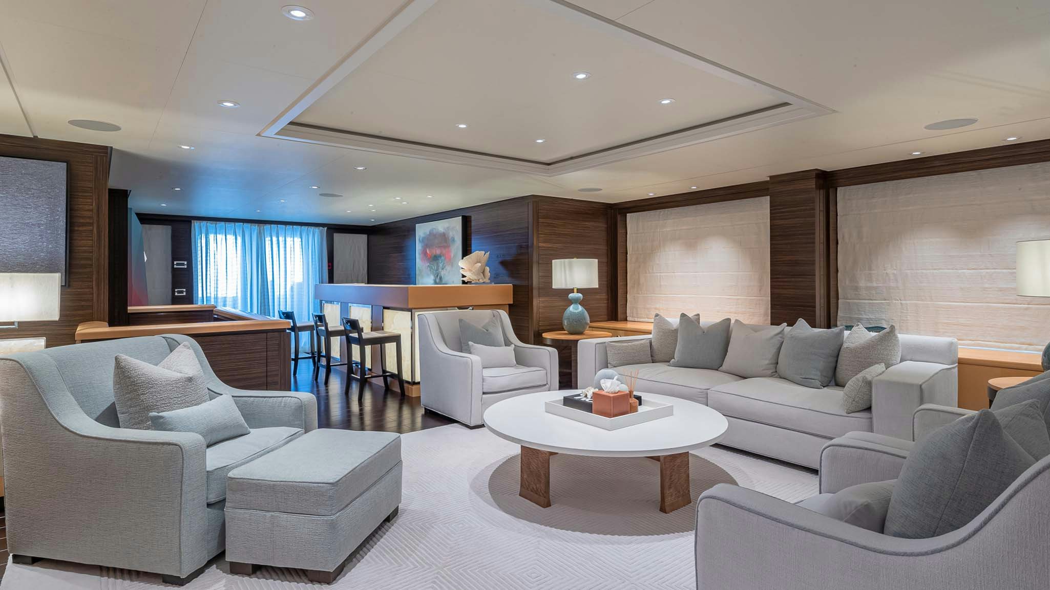 a living room with a couch and a table aboard REVELRY Yacht for Charter