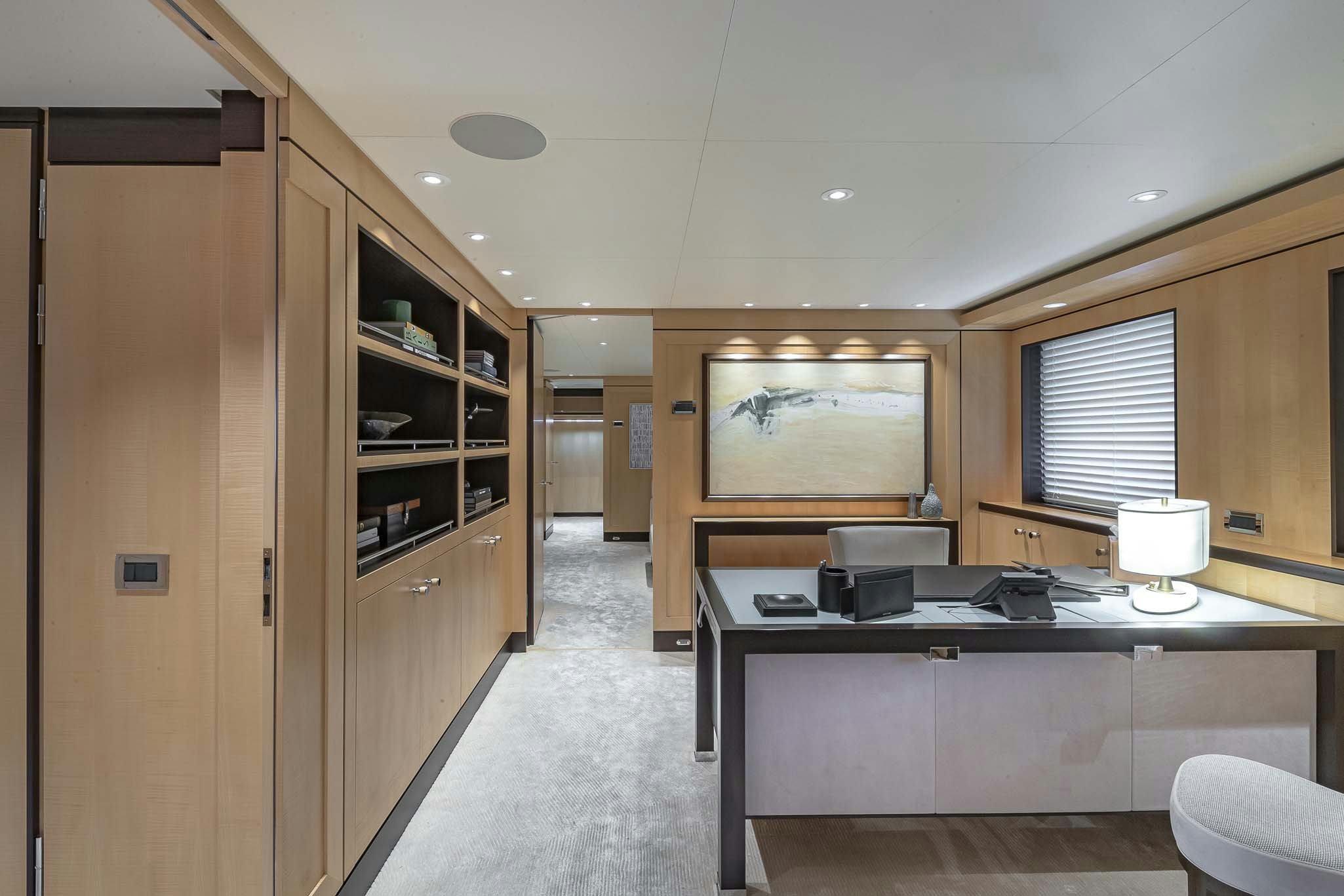a room with a desk and a chair aboard REVELRY Yacht for Charter