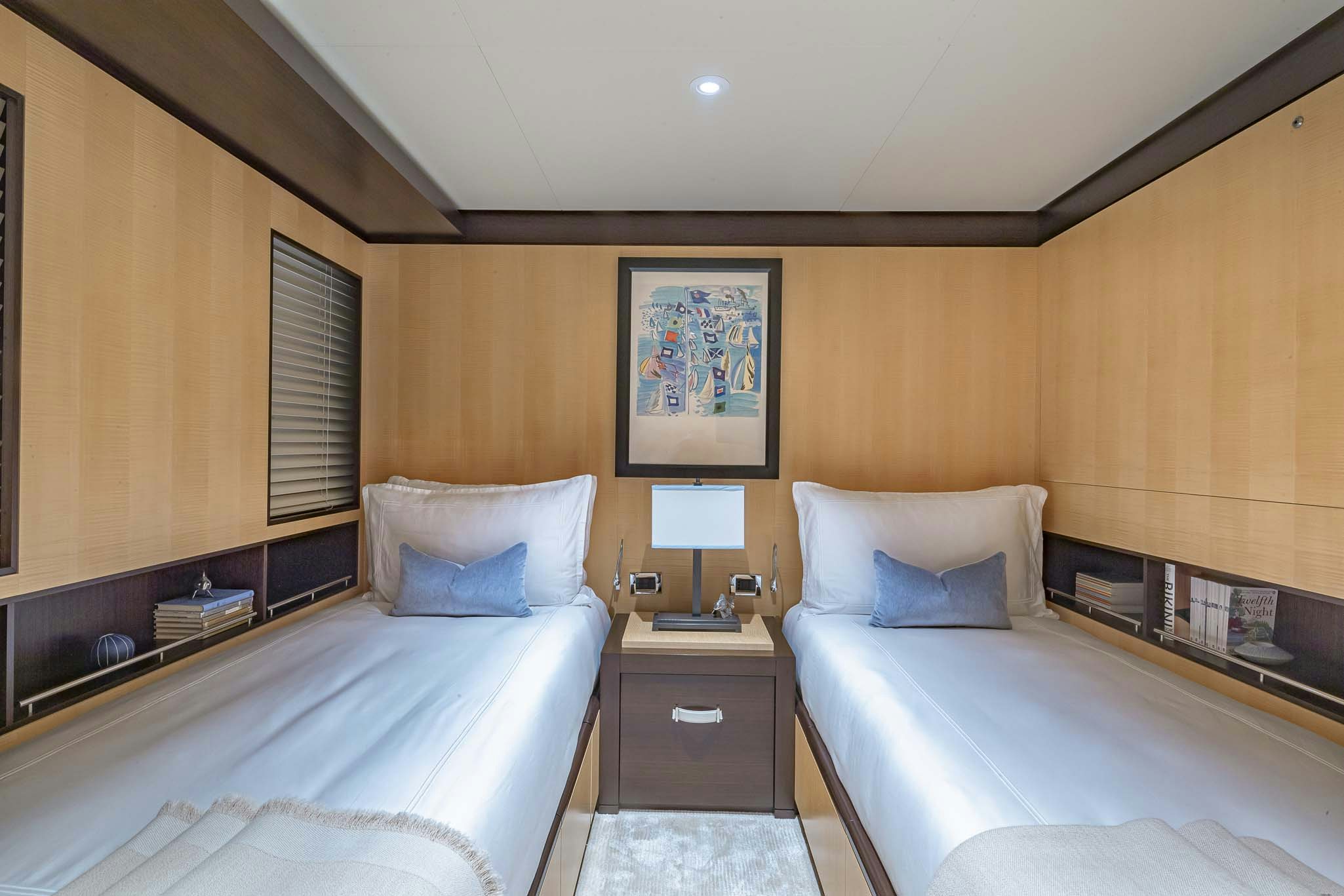 a hotel room with two beds aboard REVELRY Yacht for Charter