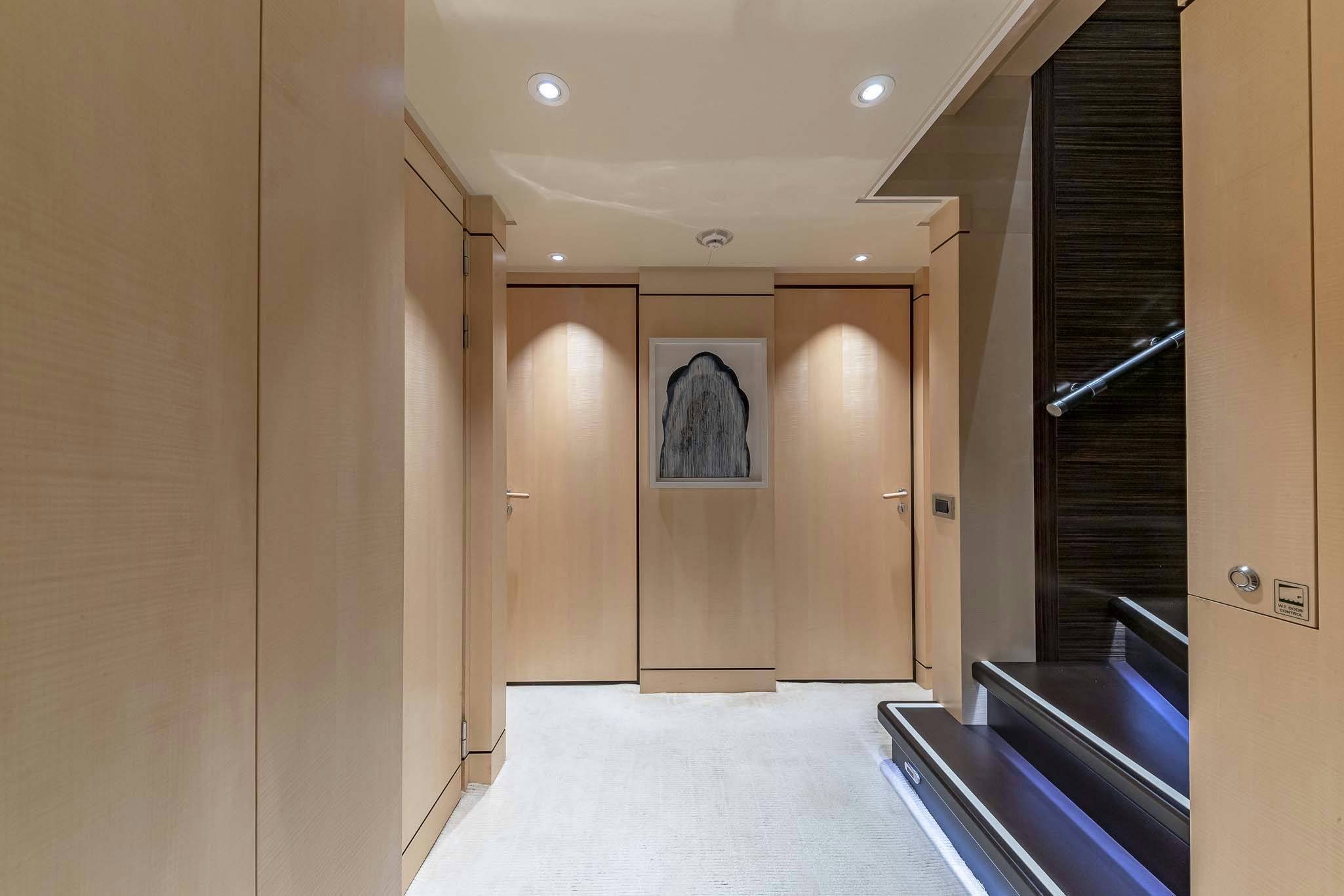 a hallway with doors aboard REVELRY Yacht for Charter