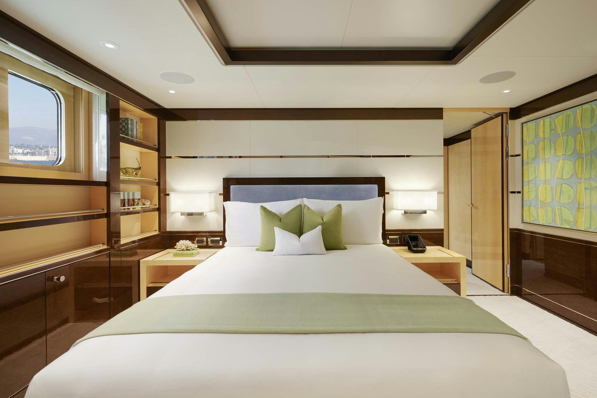 a bed with white sheets aboard REVELRY Yacht for Charter