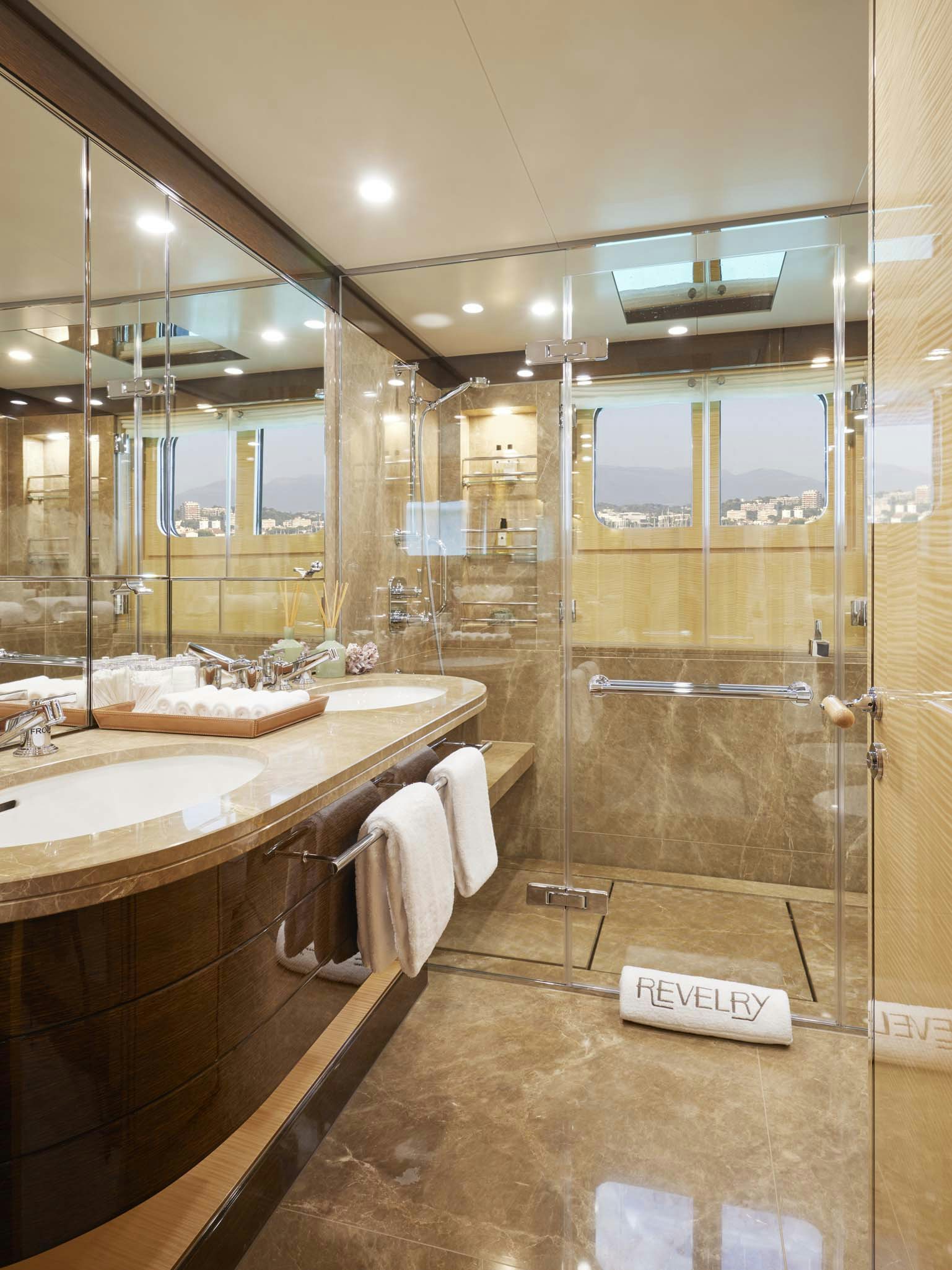 a bathroom with a glass shower aboard REVELRY Yacht for Charter