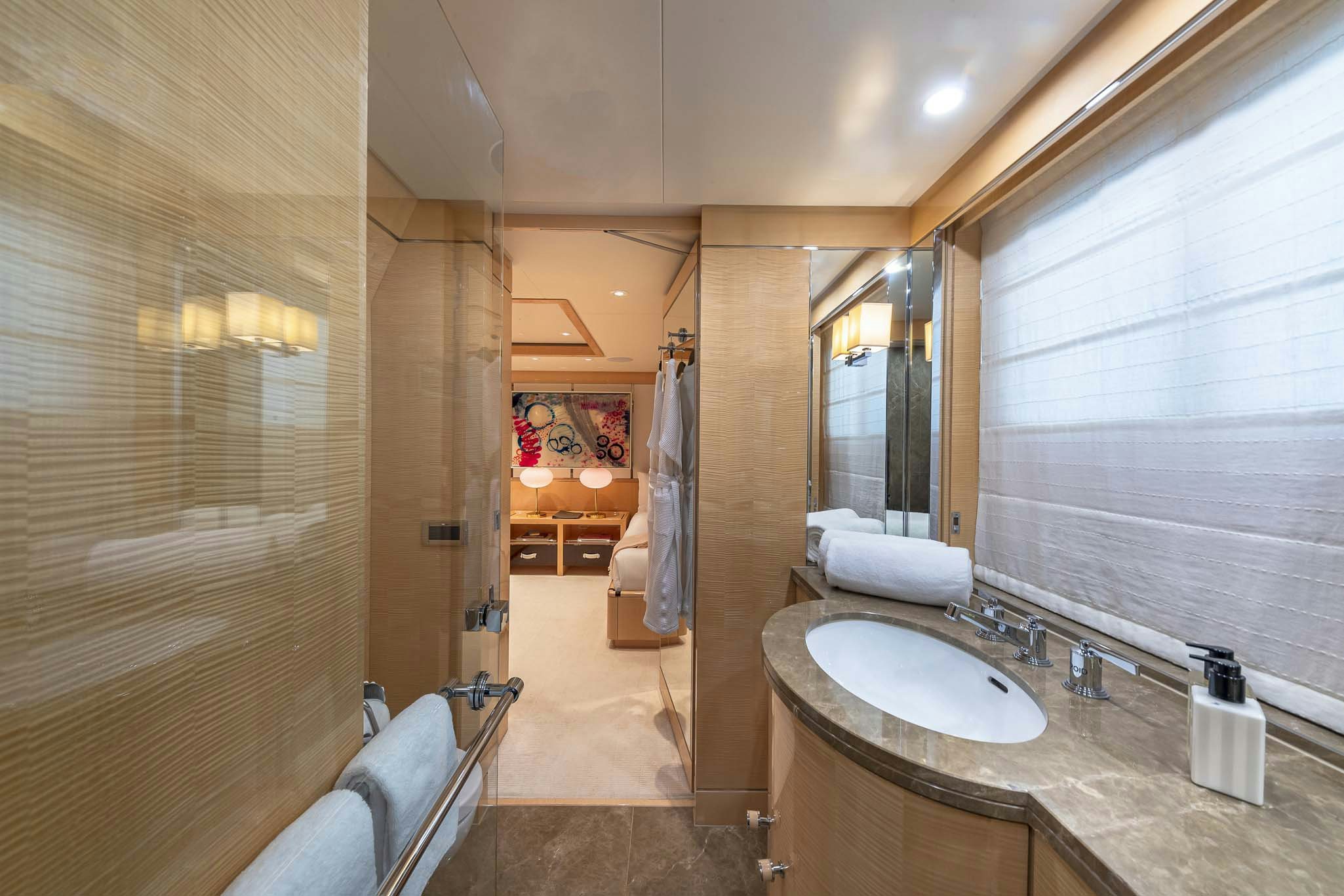 a bathroom with a sink and a bathtub aboard REVELRY Yacht for Charter