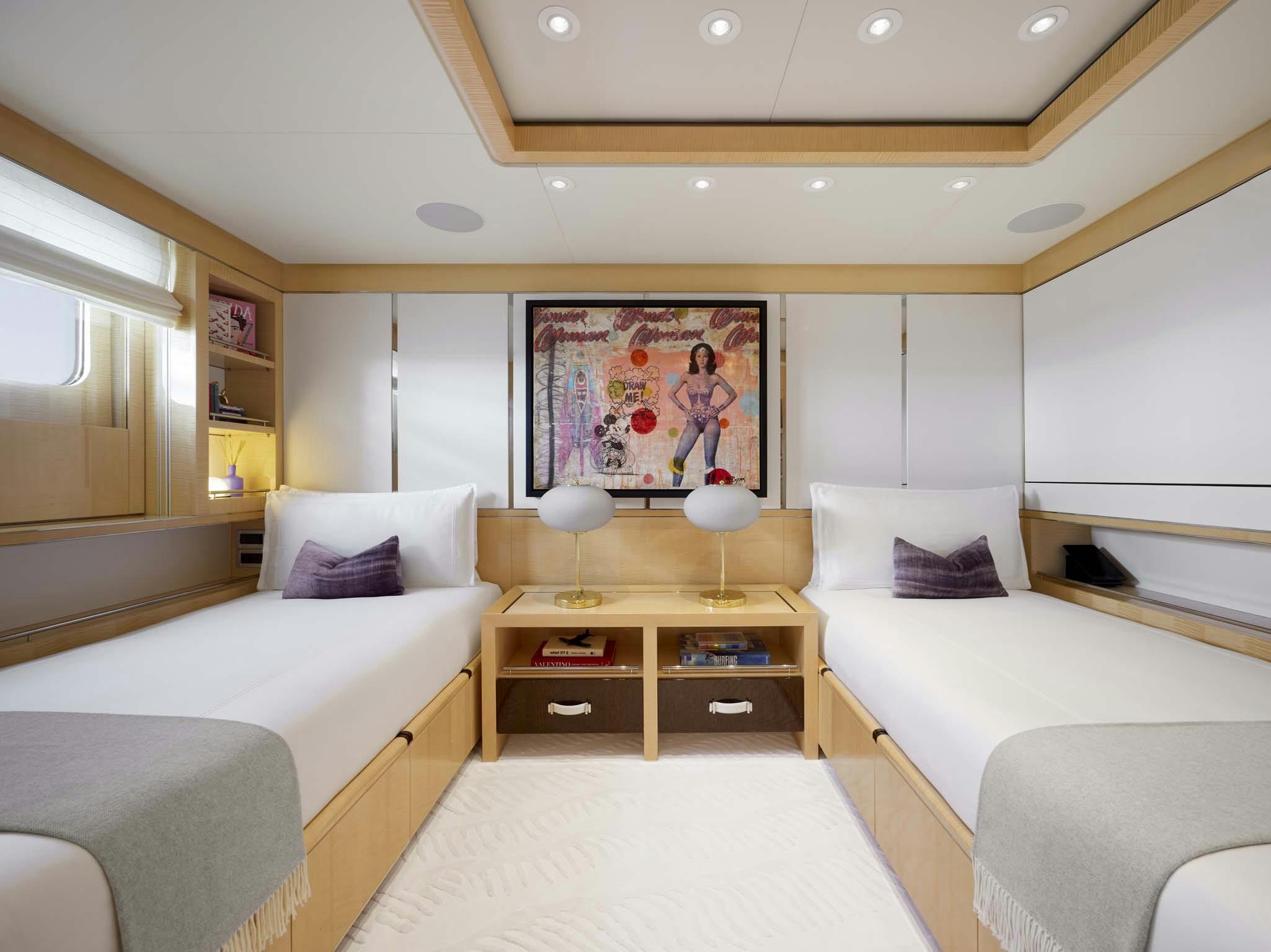 a bedroom with two beds aboard REVELRY Yacht for Charter