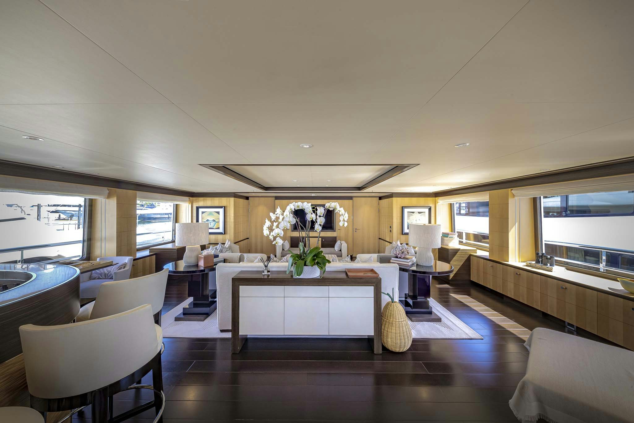 a room with a table and chairs aboard REVELRY Yacht for Charter