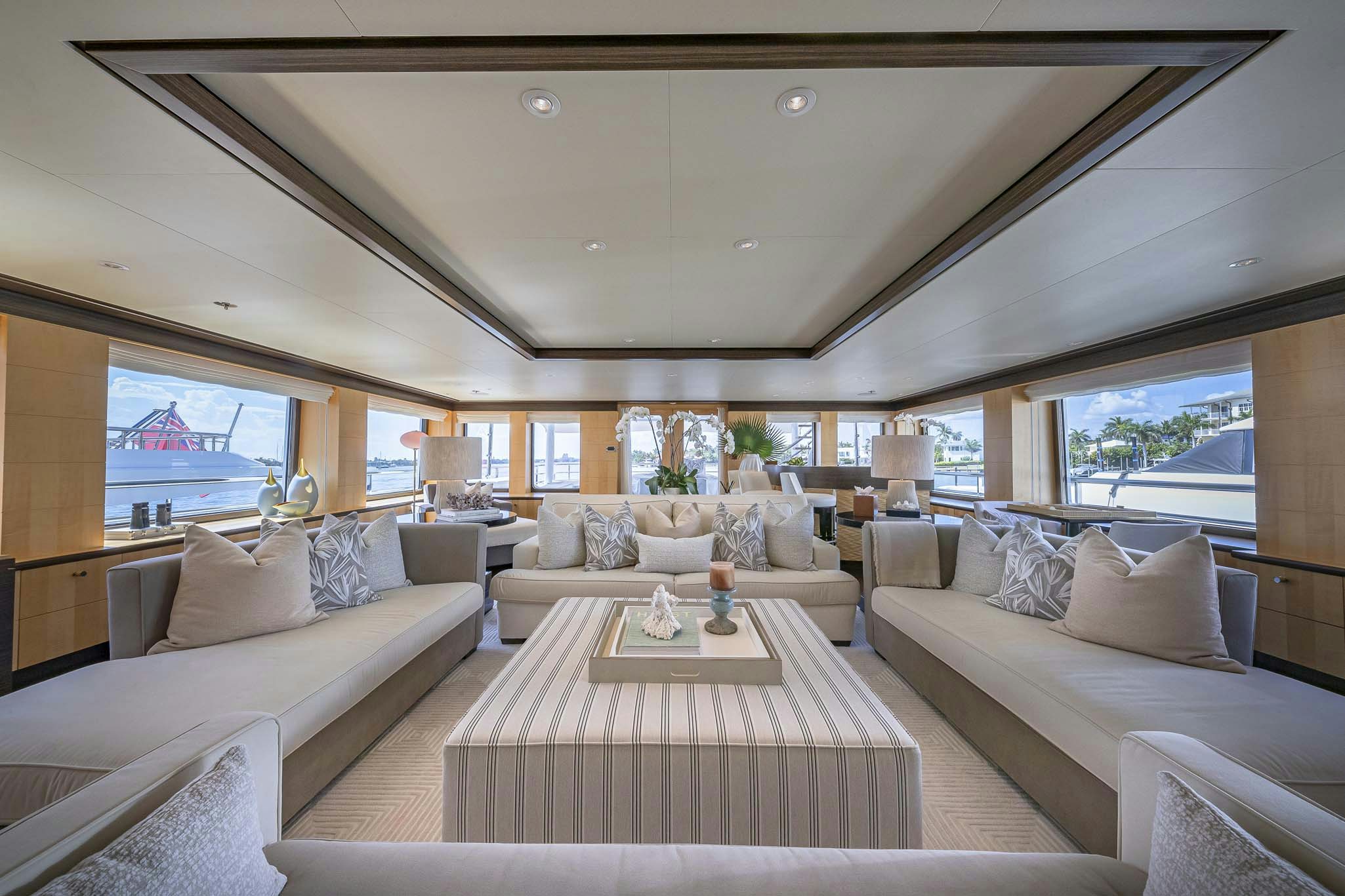 a living room with a large window aboard REVELRY Yacht for Charter