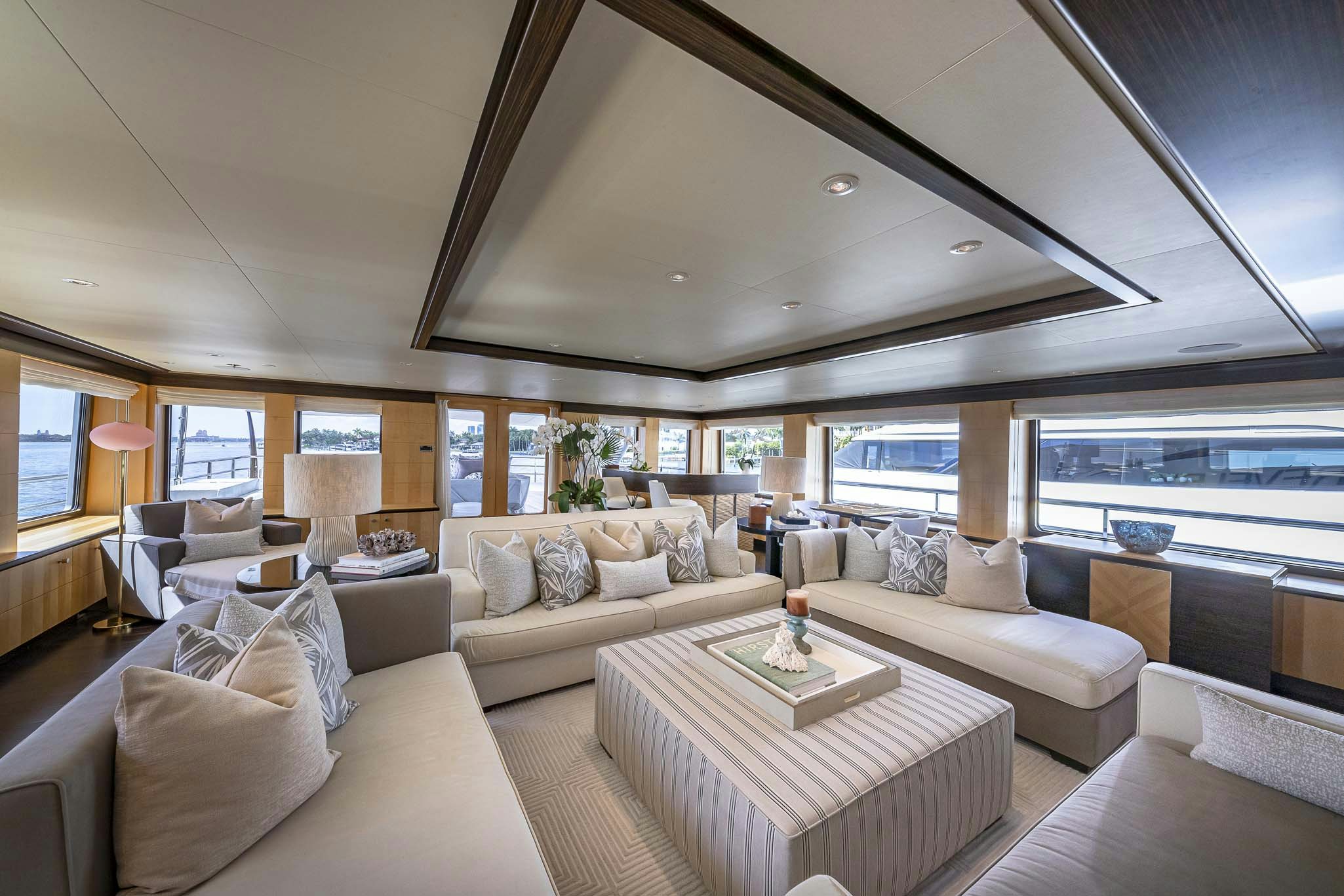 a living room with a large window aboard REVELRY Yacht for Charter