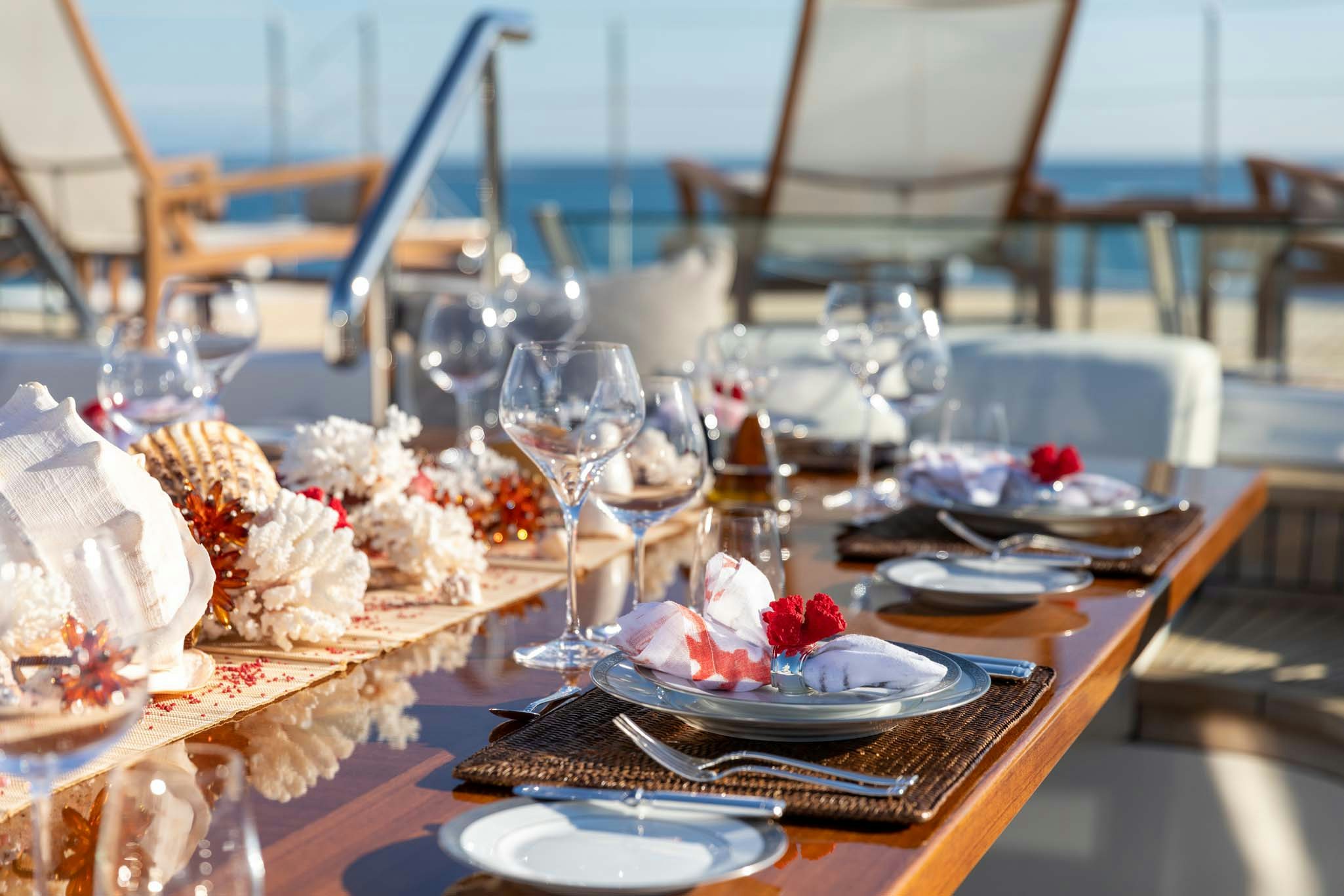 a table with food and glasses aboard REVELRY Yacht for Charter
