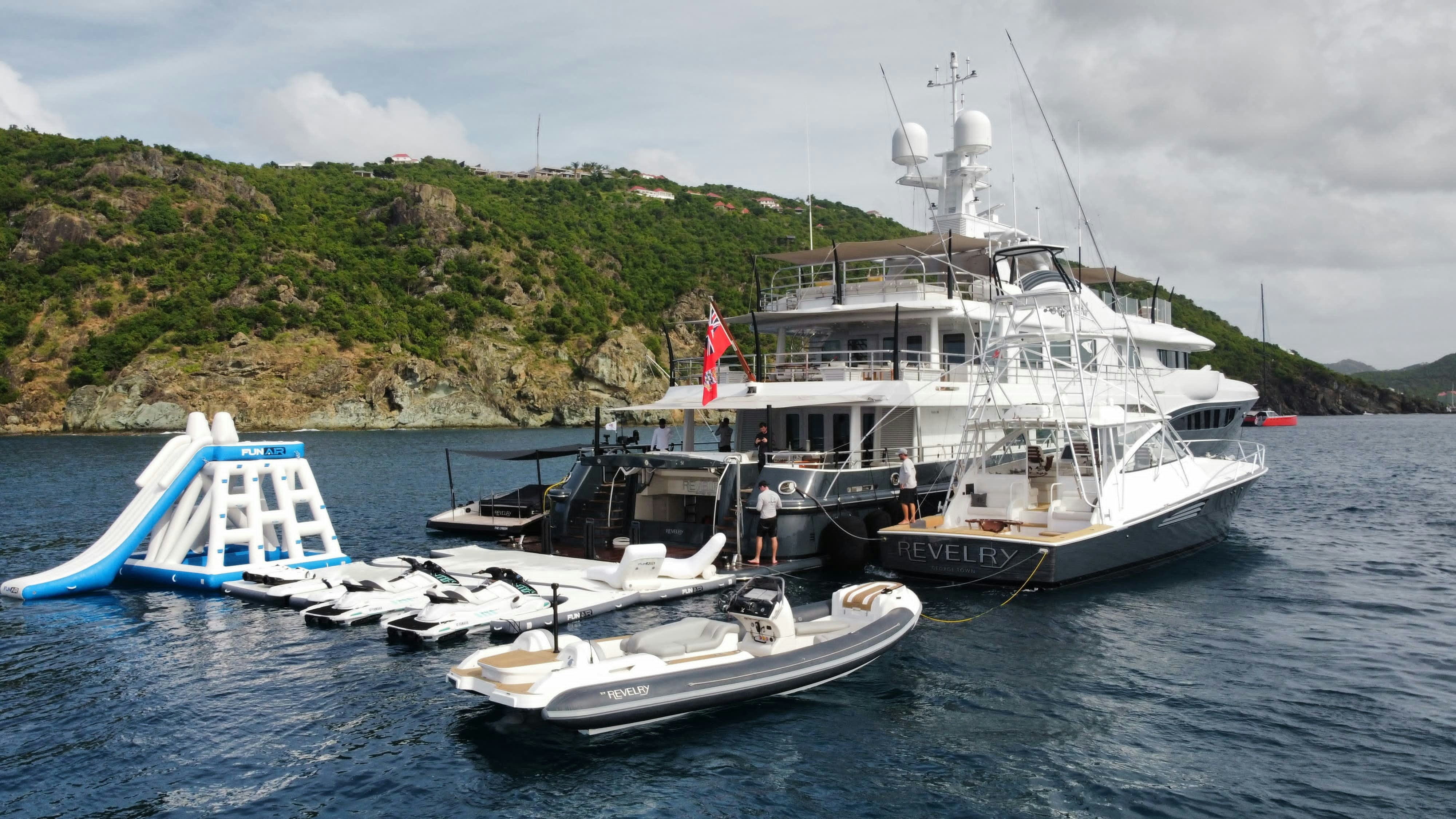a boat with a helicopter on it aboard REVELRY Yacht for Charter