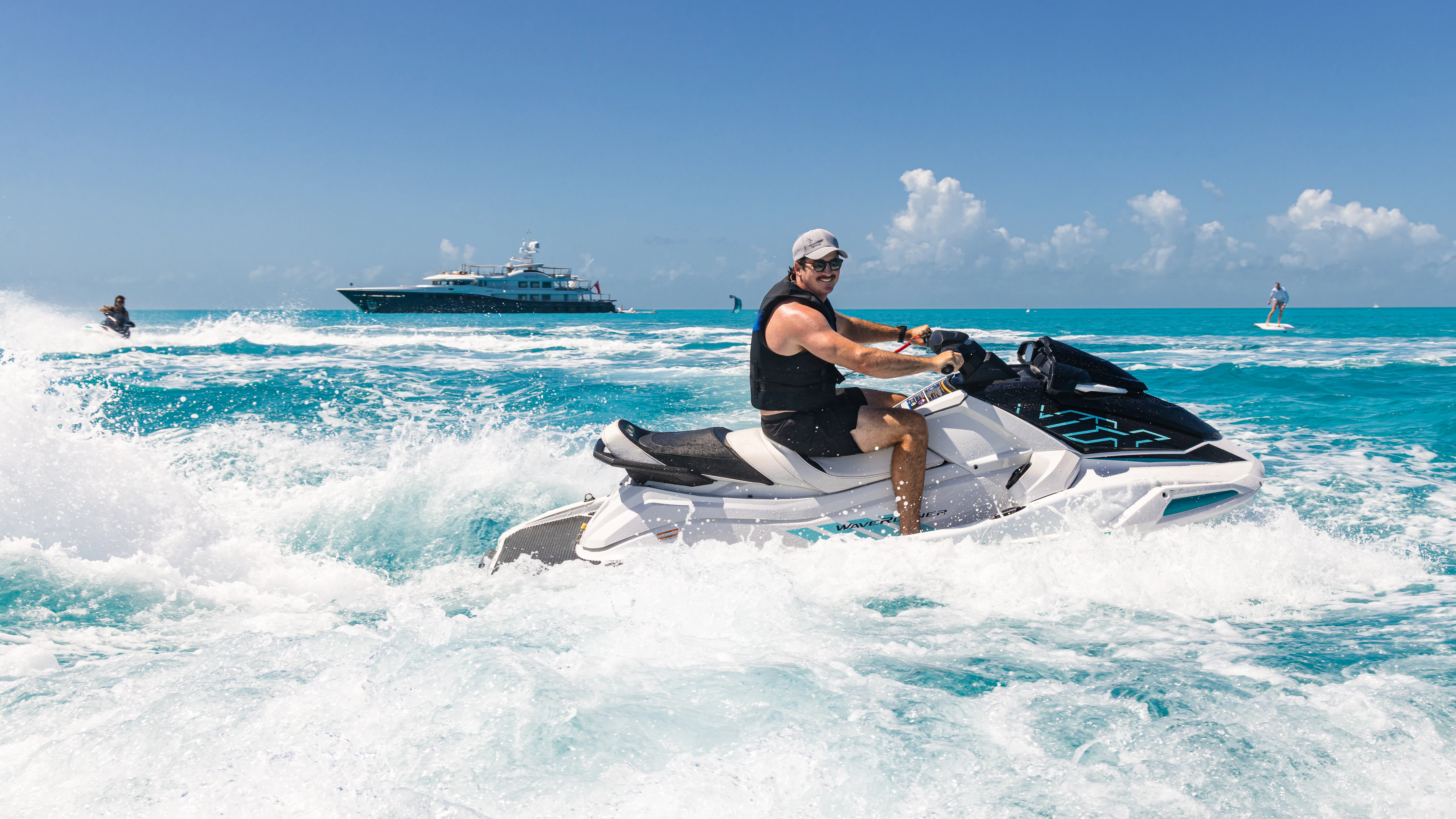 a person on a jet ski in the ocean aboard REVELRY Yacht for Charter