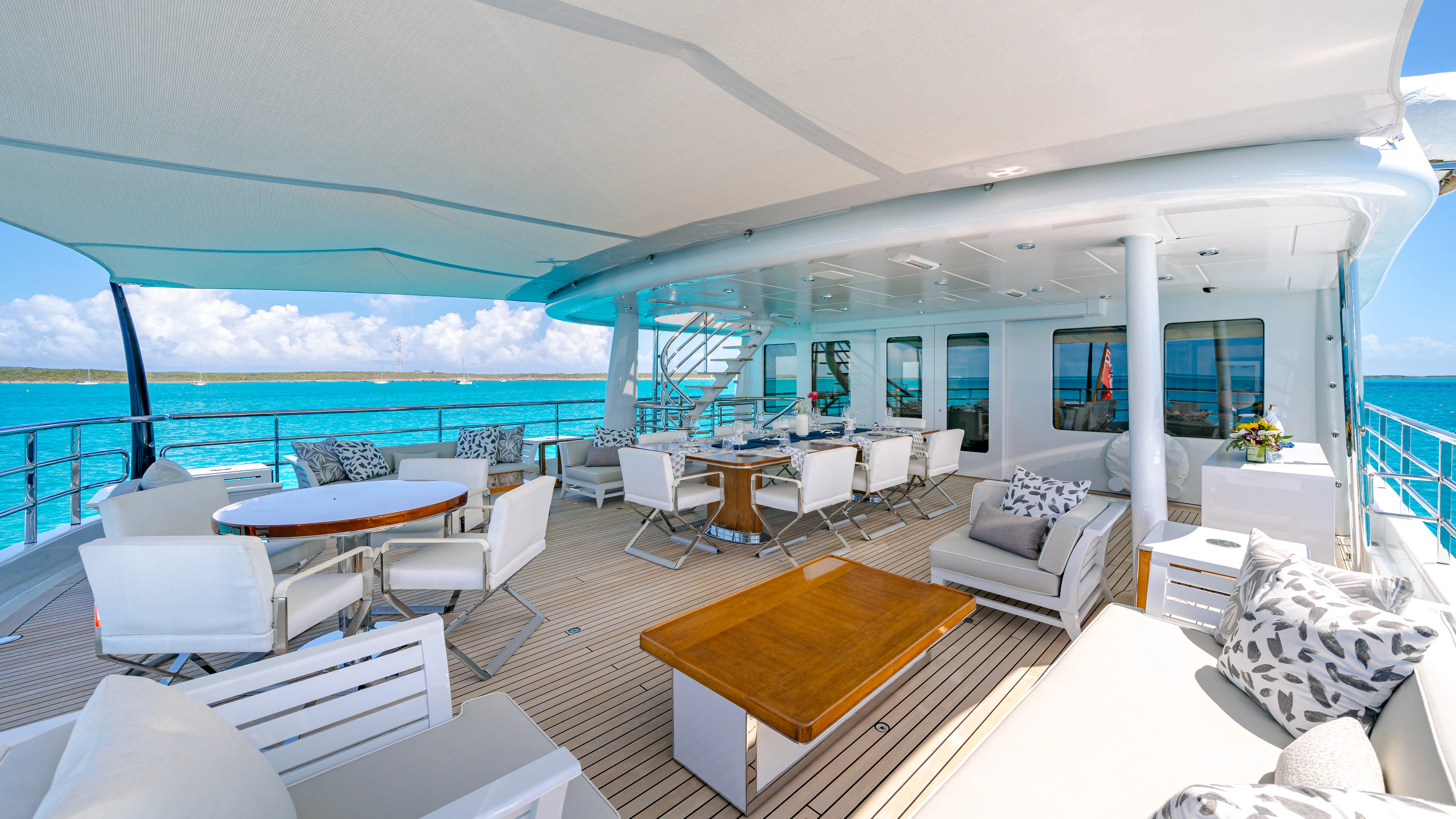 a room with a large balcony aboard REVELRY Yacht for Charter