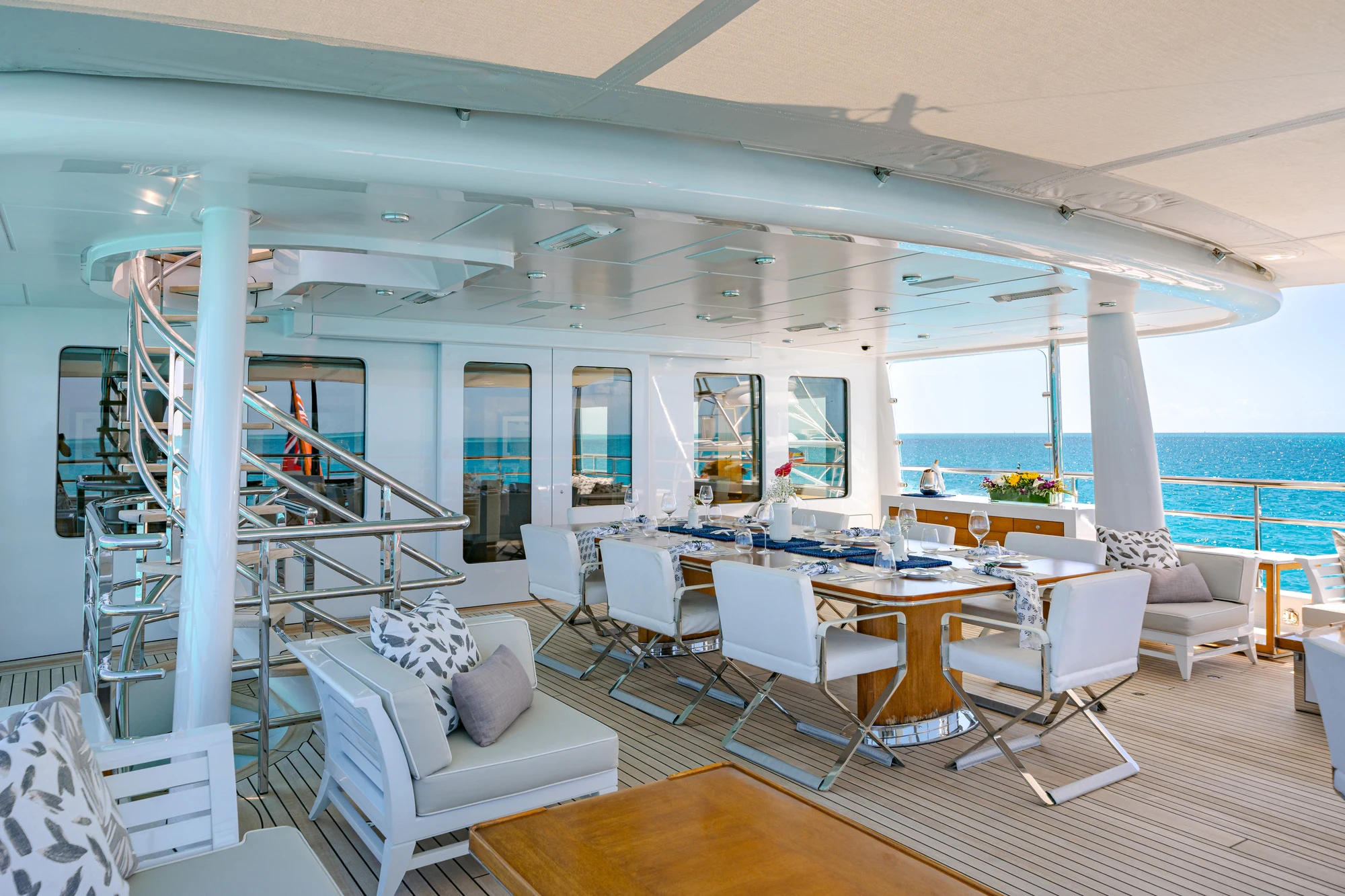 a room with a large window and a staircase aboard REVELRY Yacht for Charter