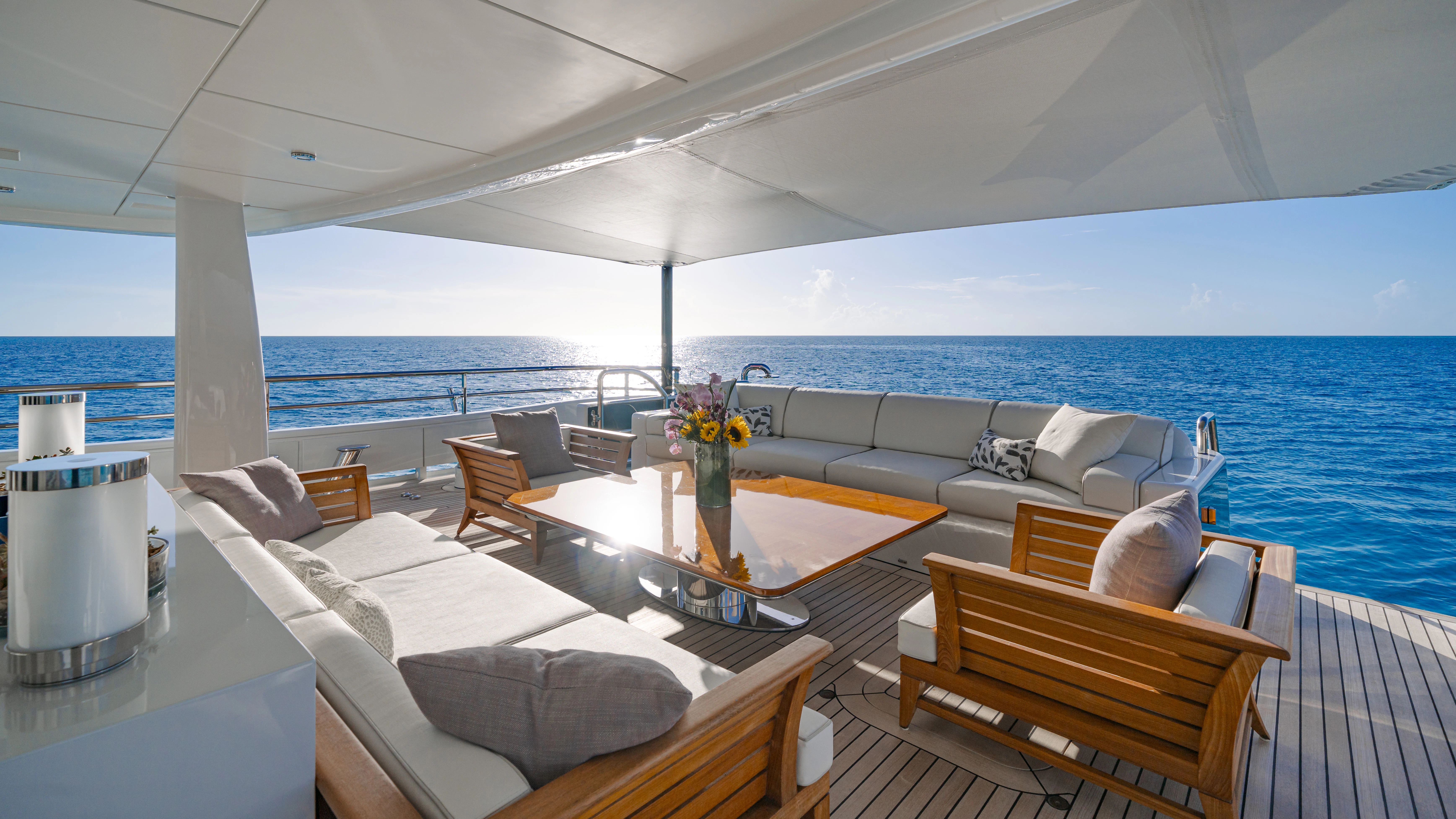 a room with a table and chairs aboard REVELRY Yacht for Charter