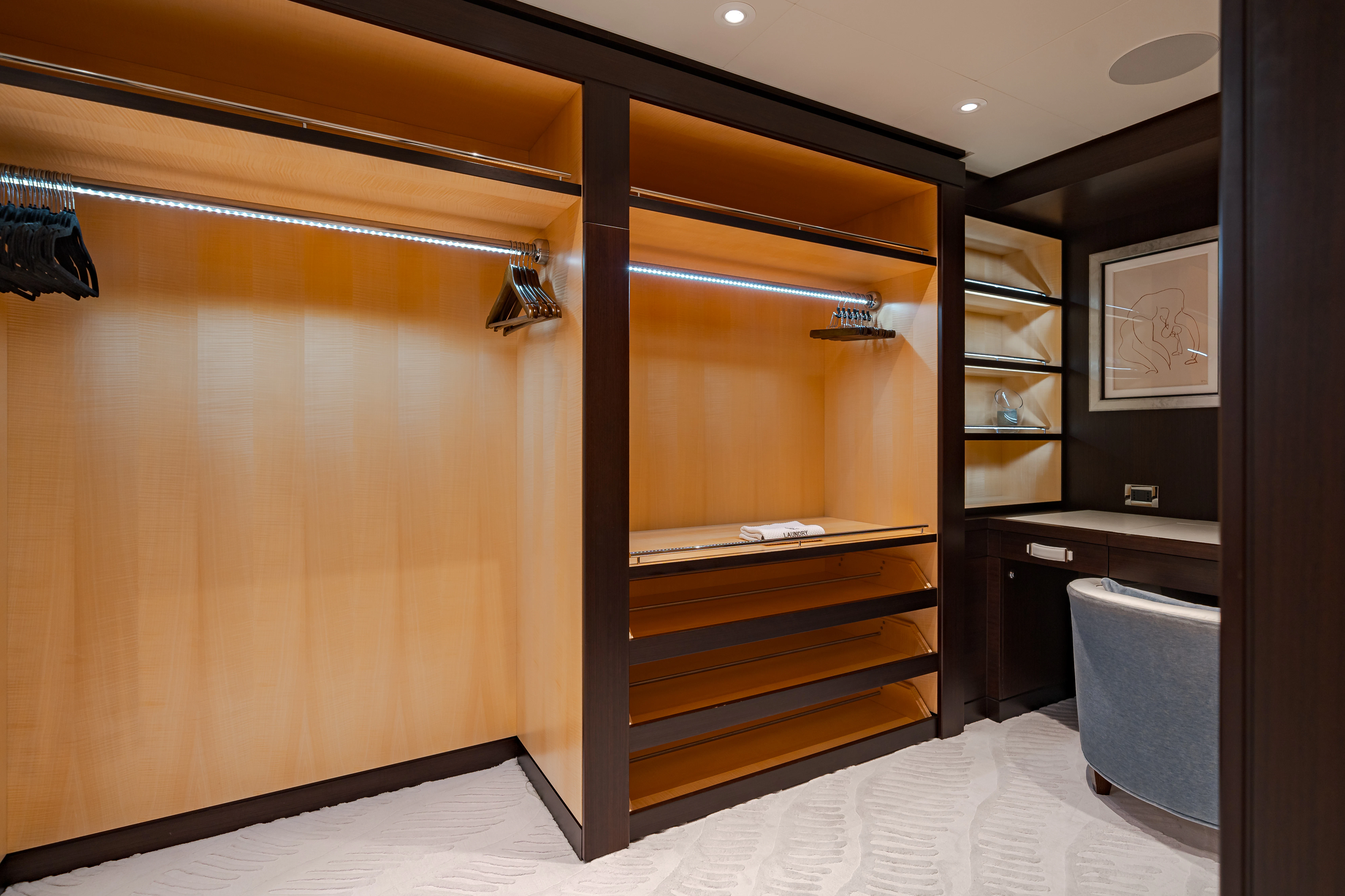a room with a wood cabinet and shelves aboard REVELRY Yacht for Charter