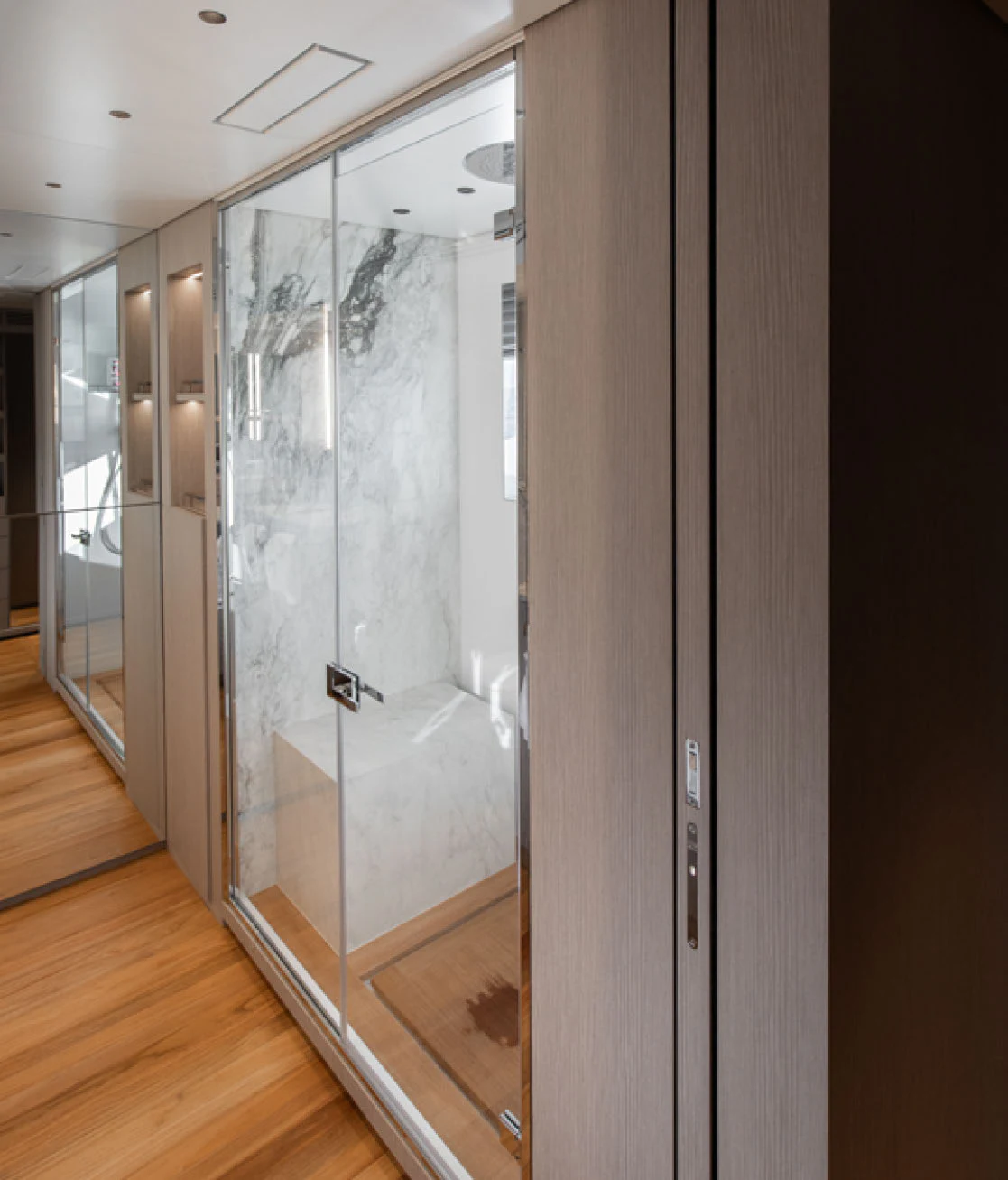 a room with a glass door aboard CADA DIA Yacht for Charter