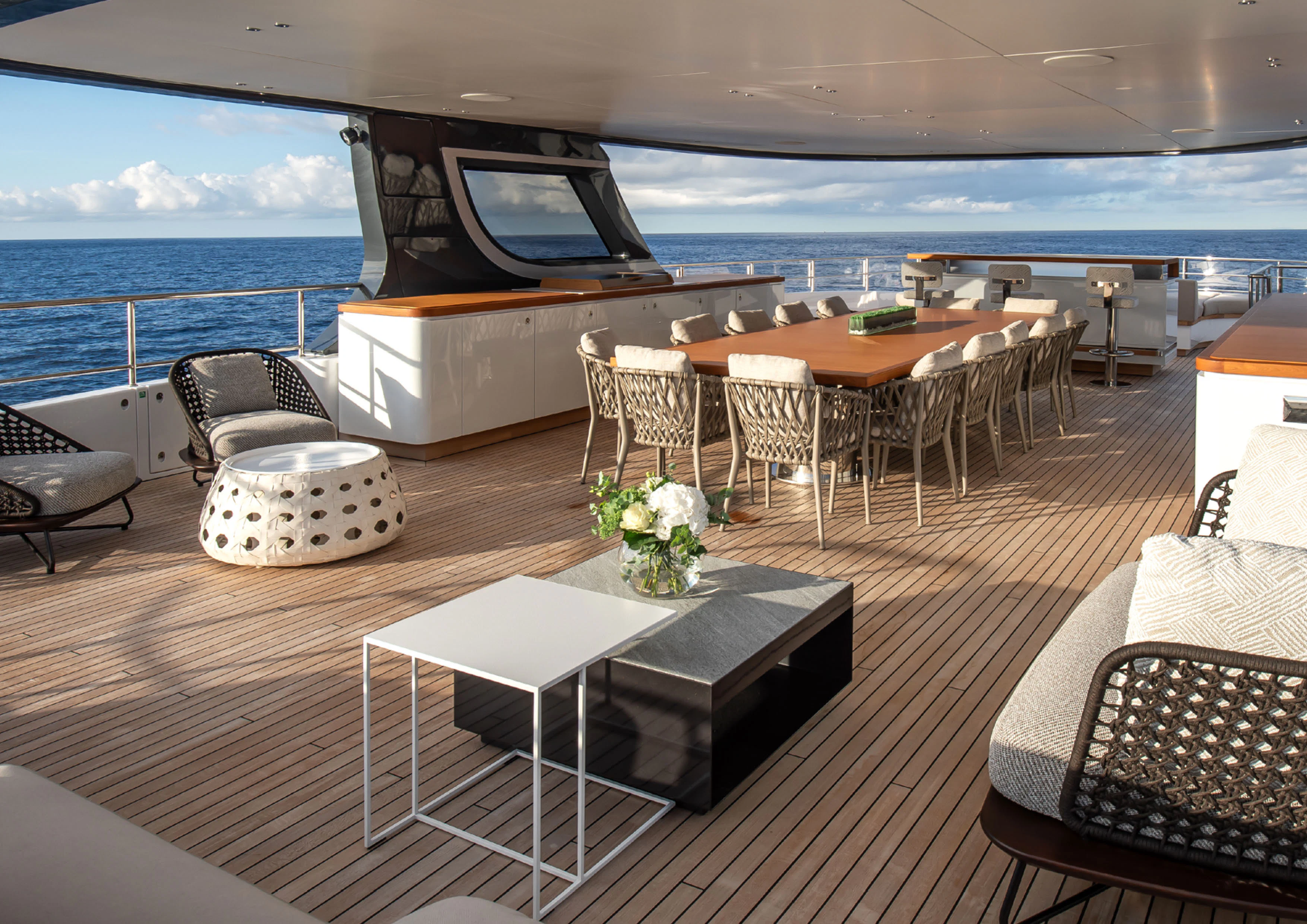 a room with a table and chairs aboard CADA DIA Yacht for Charter