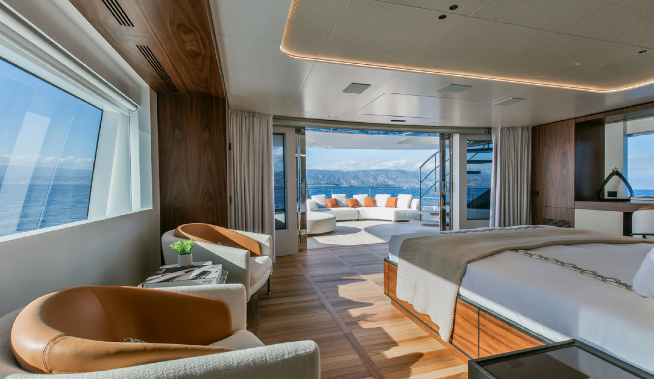 a room with a bed and a window aboard CADA DIA Yacht for Charter