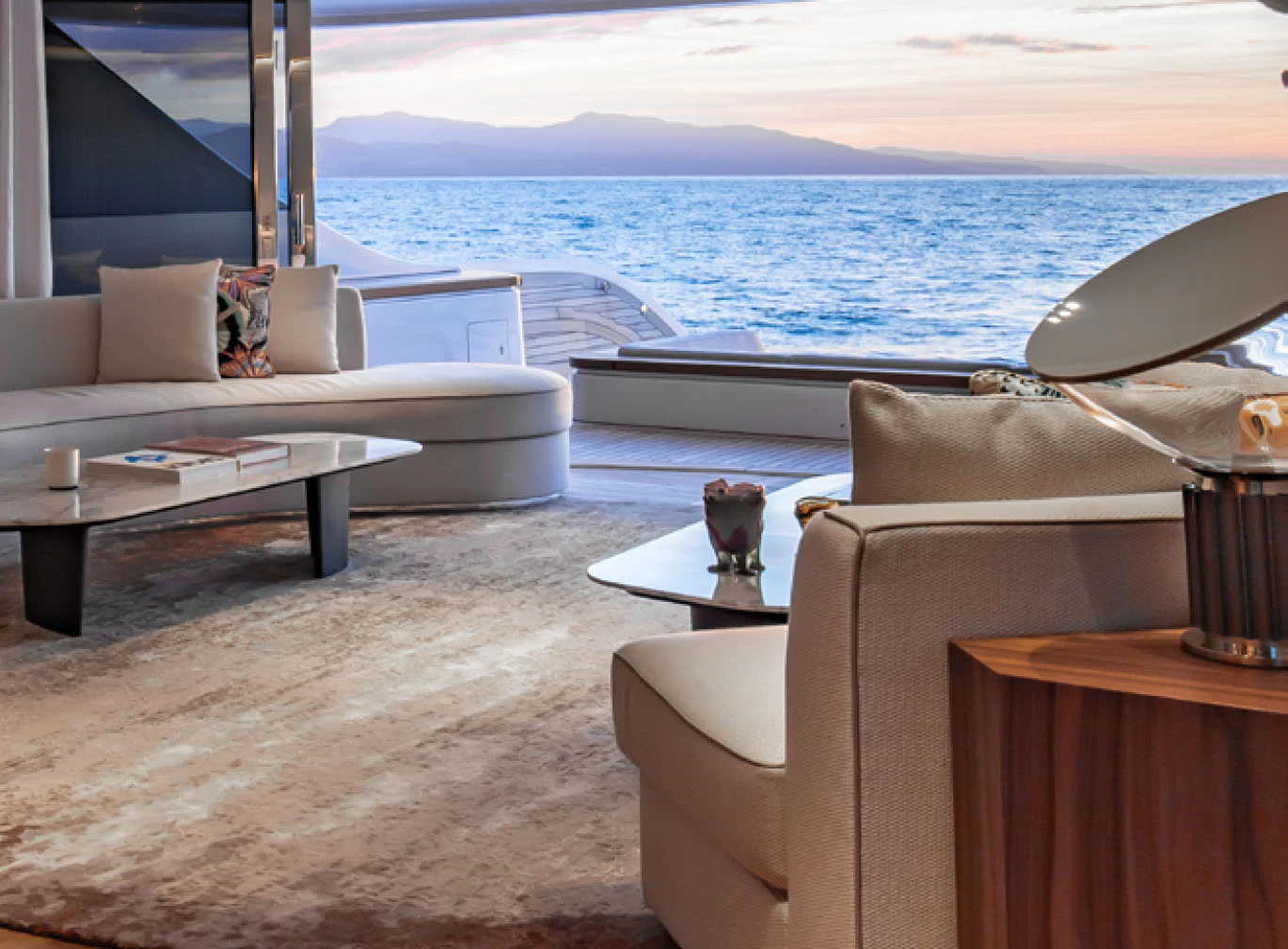 a room with a couch and a table and a chair aboard CADA DIA Yacht for Charter