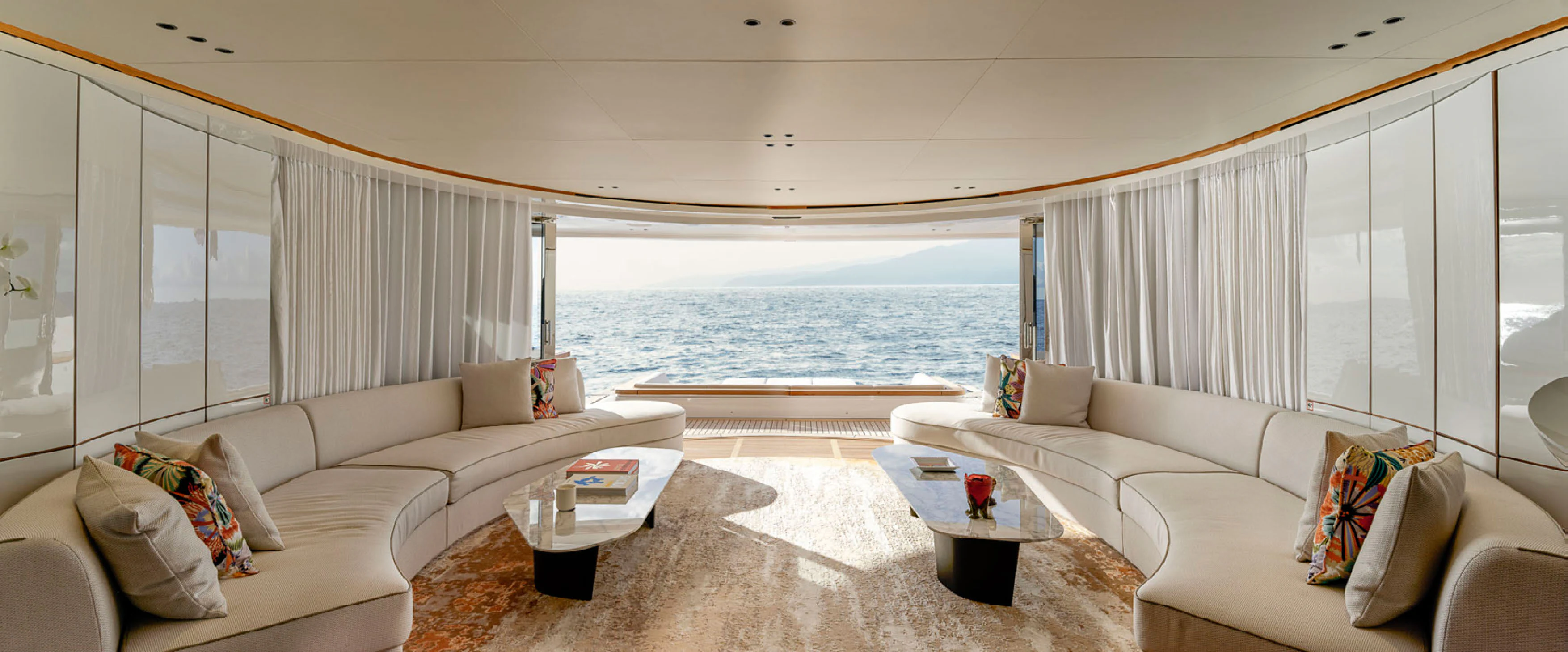 a living room with a couch and a table aboard CADA DIA Yacht for Charter